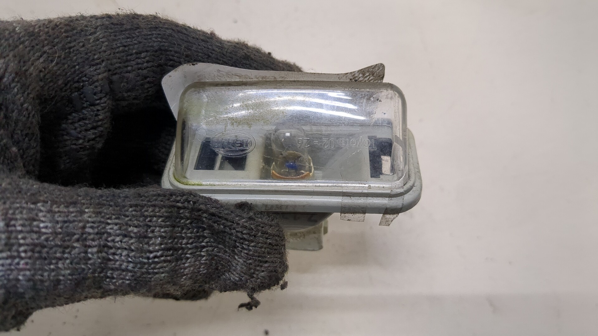 Фонарь подсветки номера