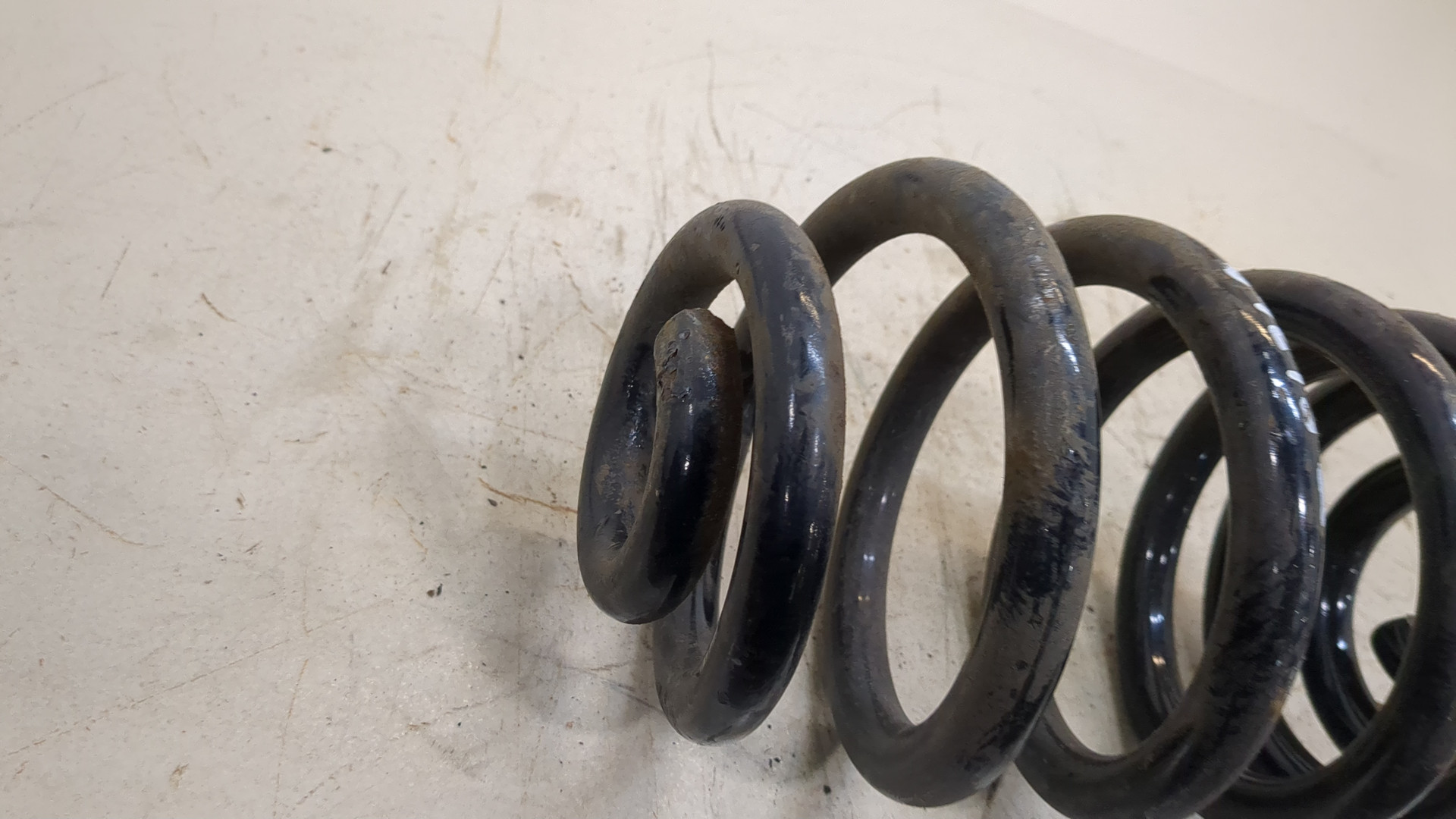 Пружина задняя