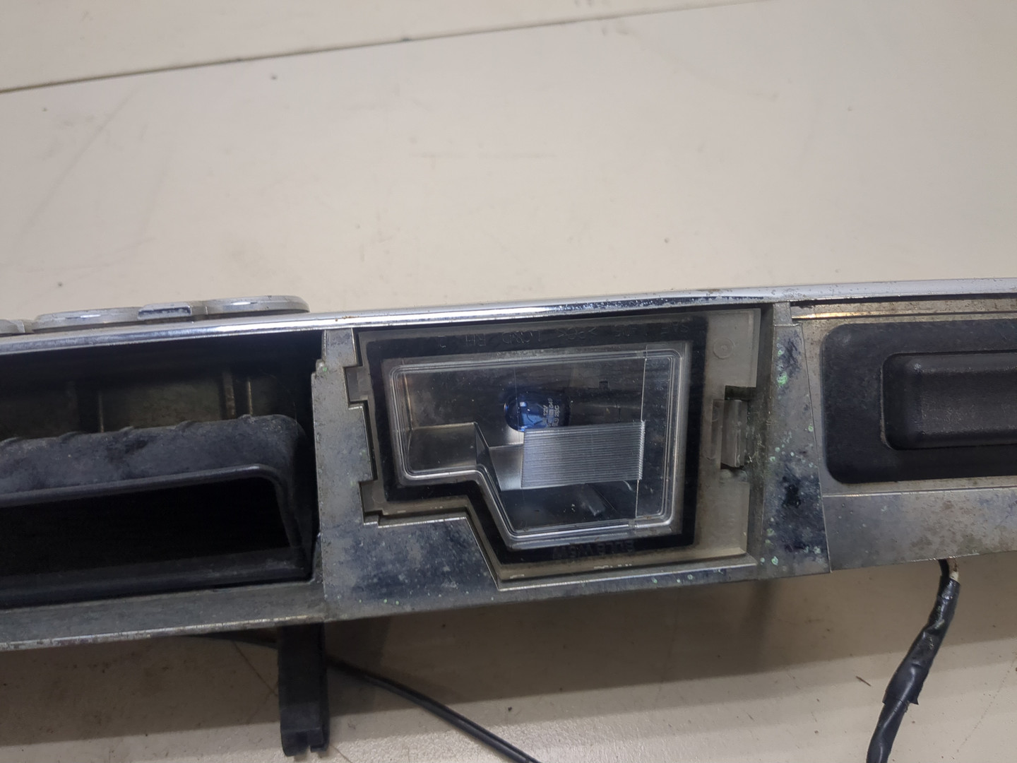 Фонарь подсветки номера