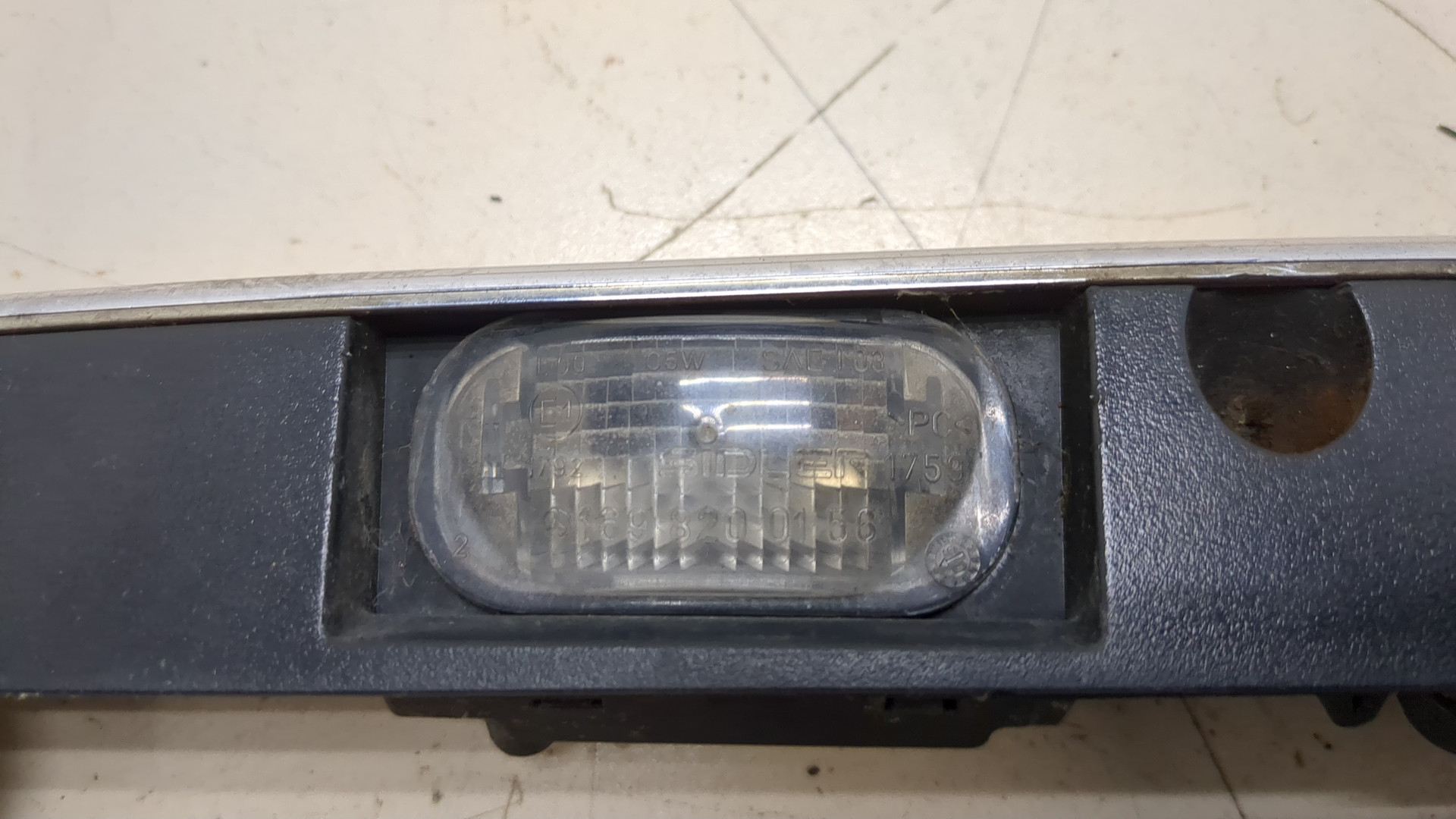 Фонарь подсветки номера