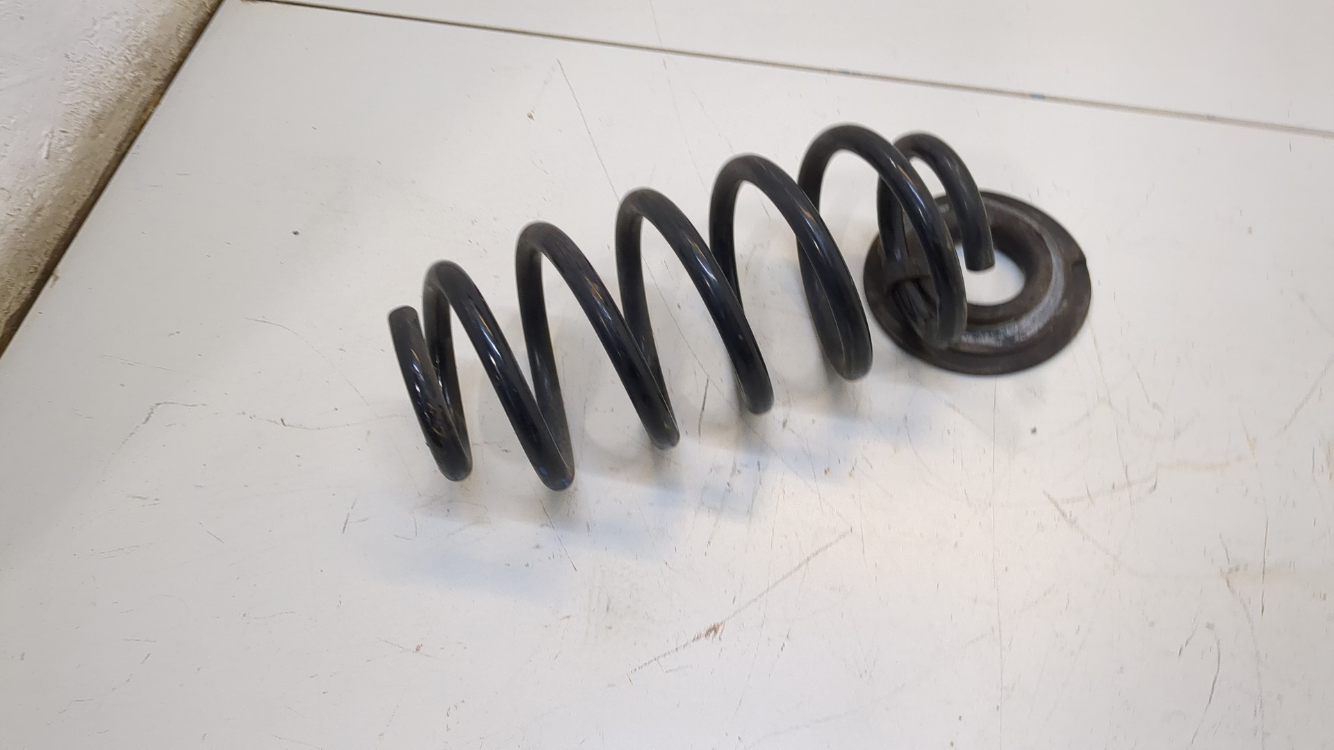 Пружина задняя