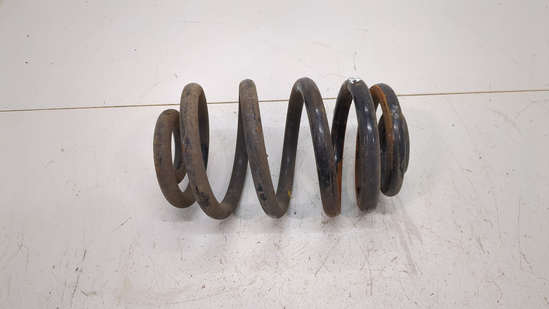 Пружина задняя