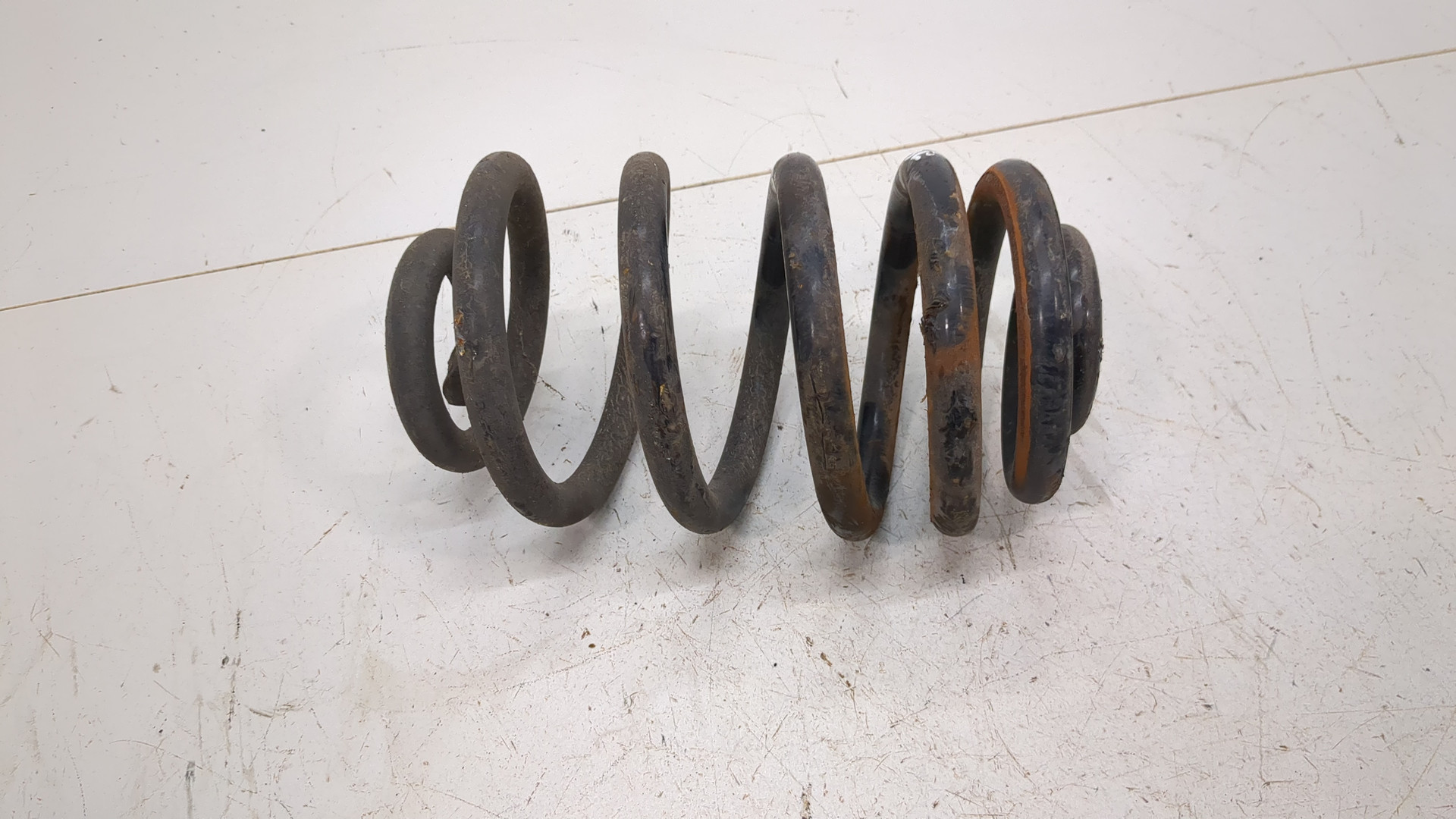 Пружина задняя