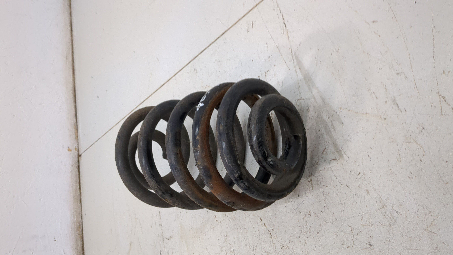 Пружина задняя