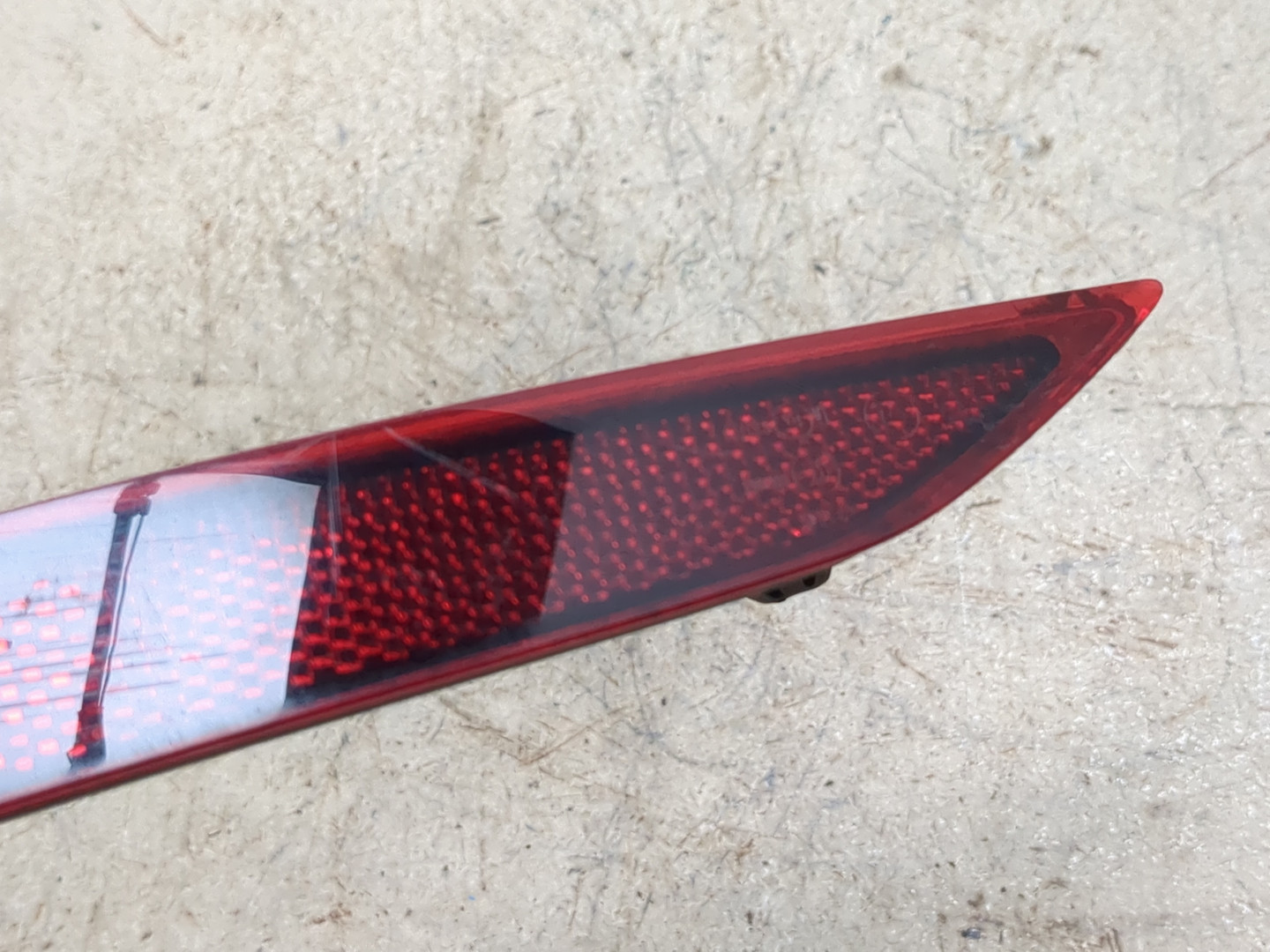 Отражатель в бампер задний левый