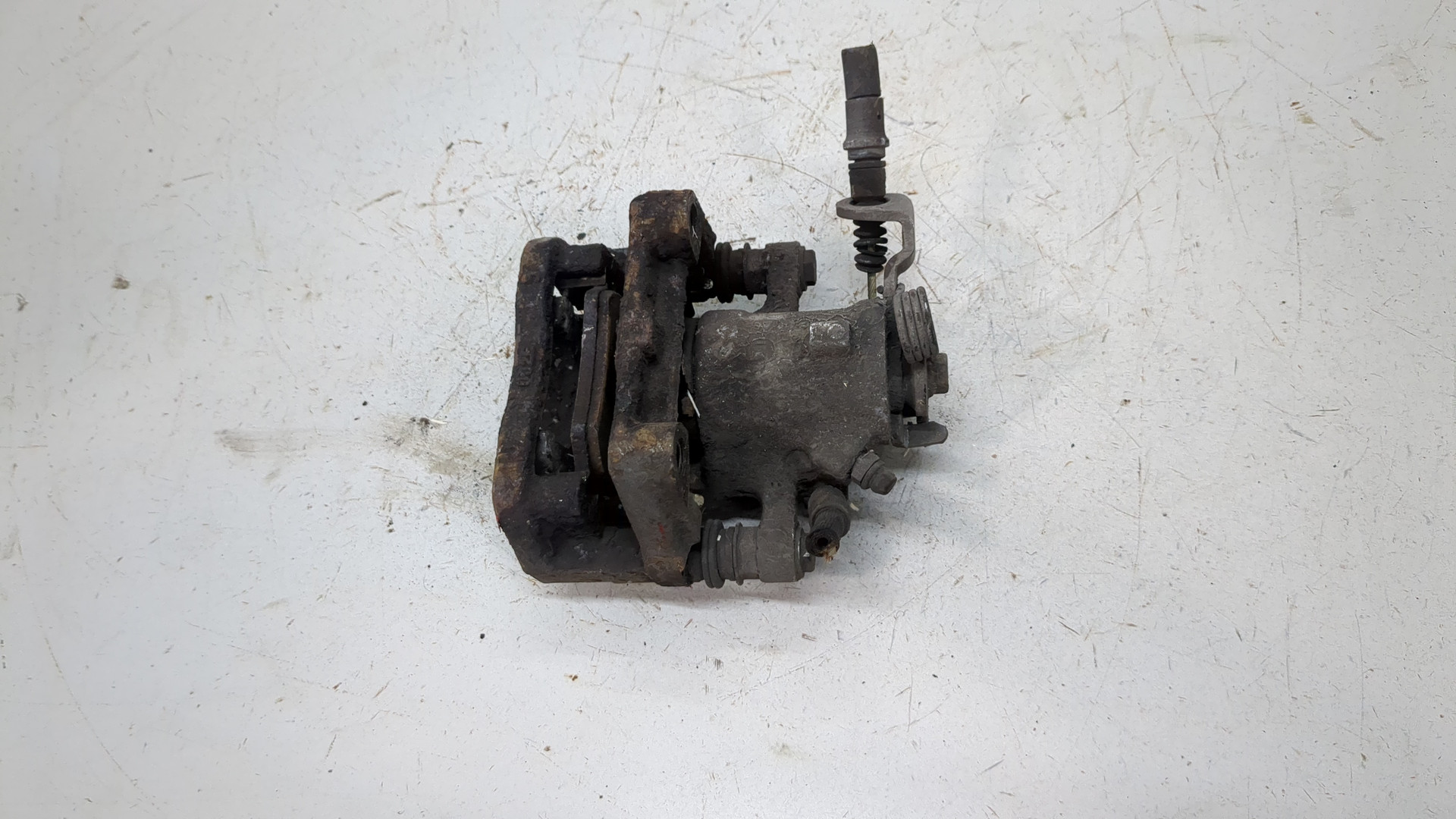 Суппорт задний левый