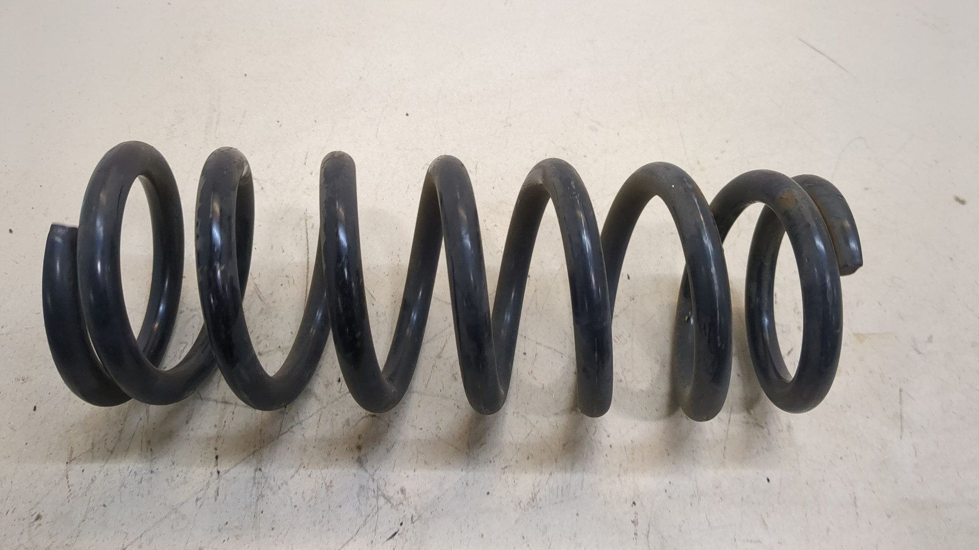 Пружина задняя