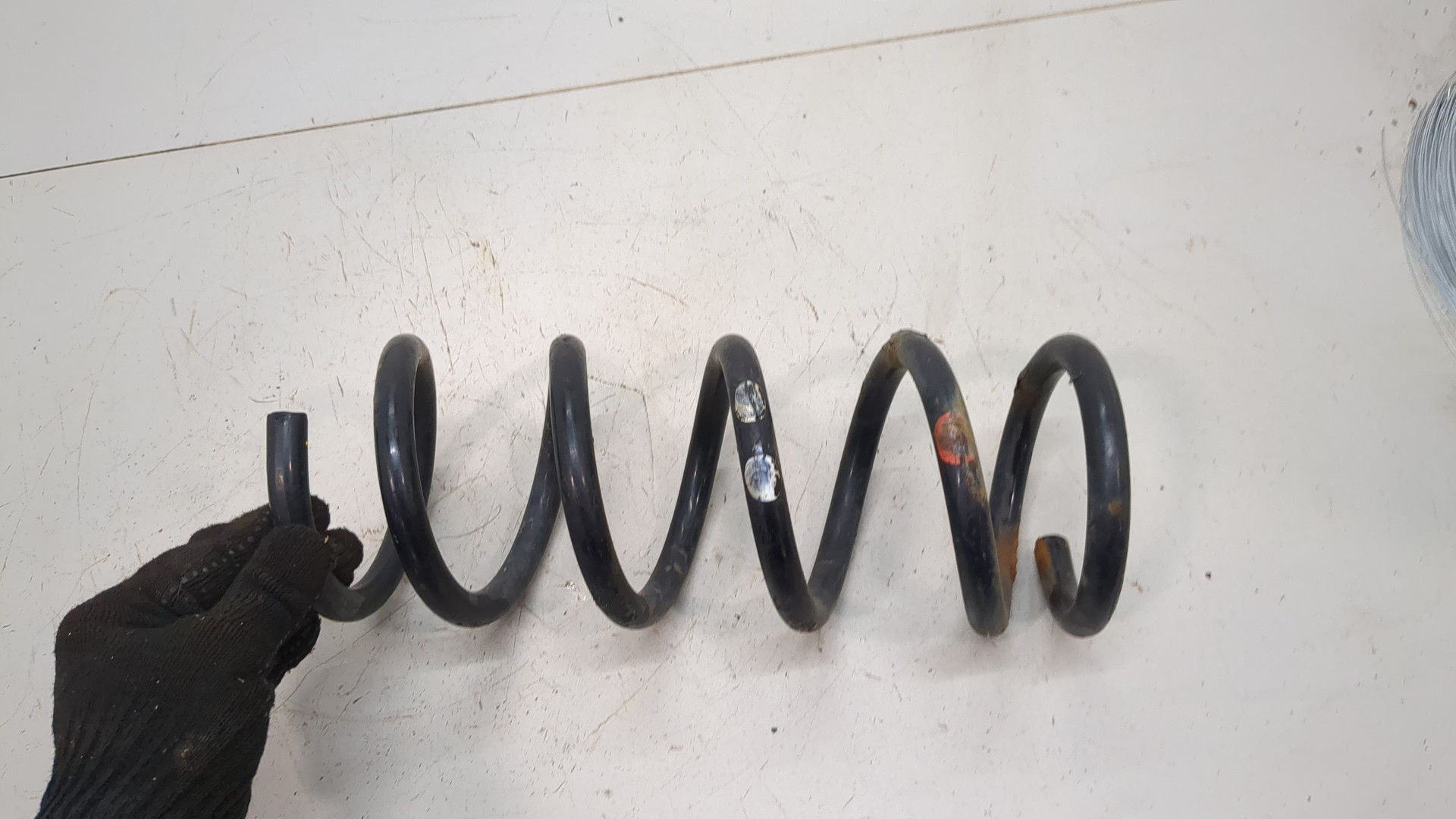 Пружина задняя