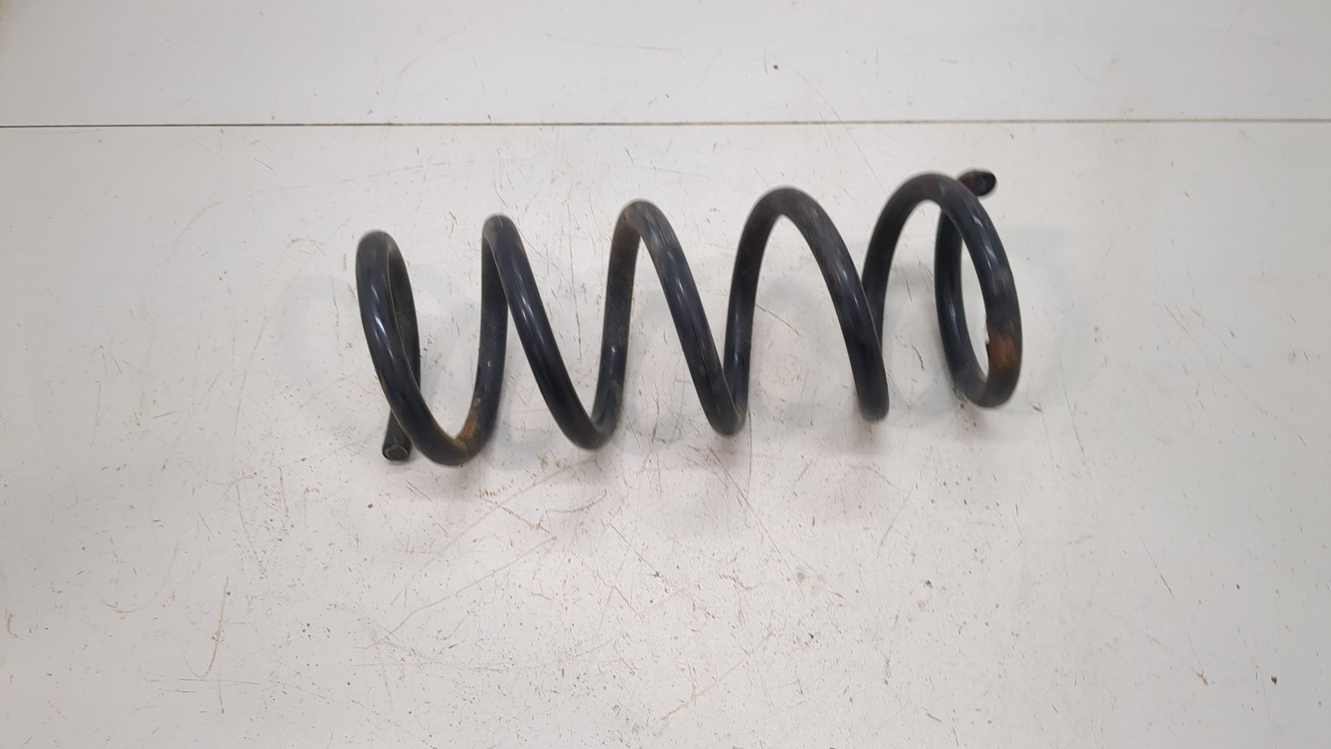 Пружина задняя