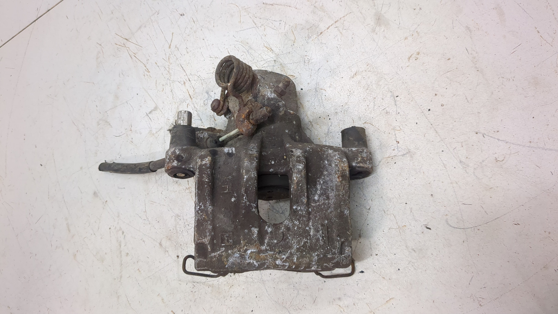 Суппорт задний левый