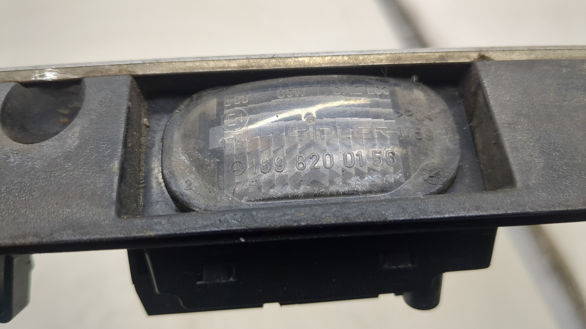 Фонарь подсветки номера