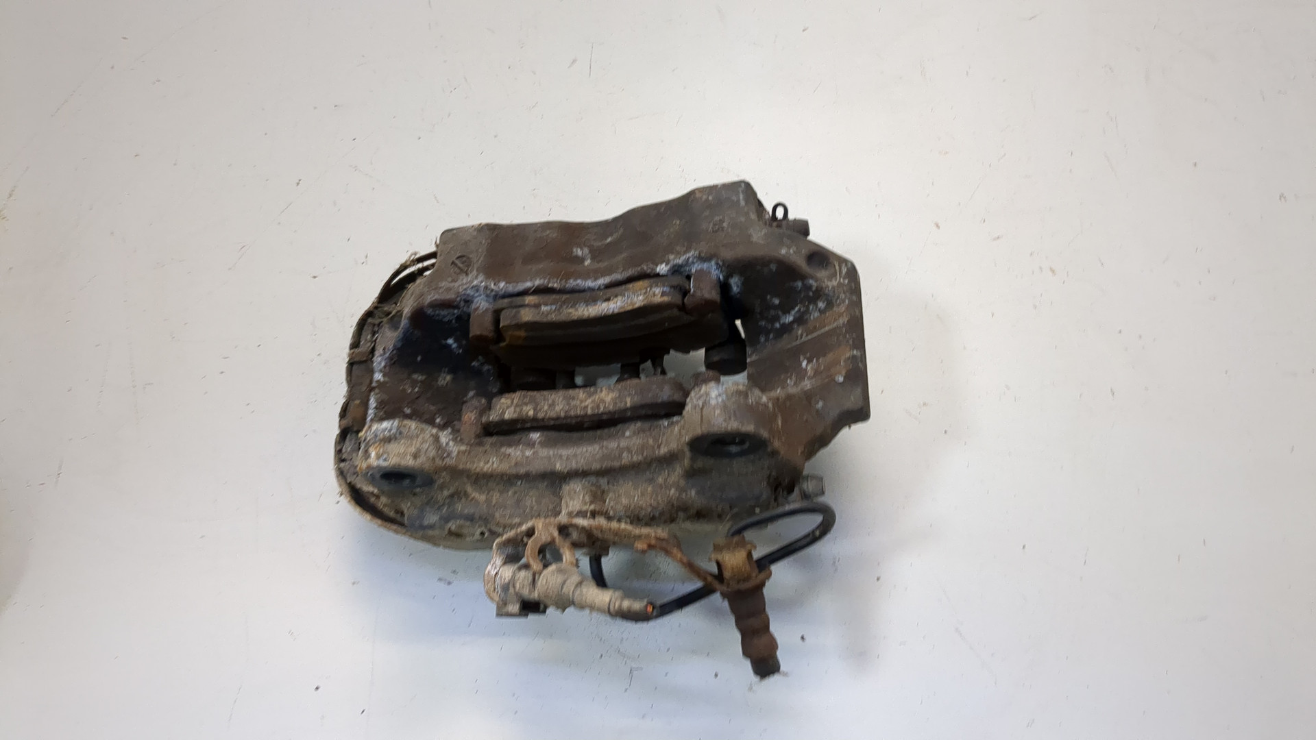 Суппорт задний левый