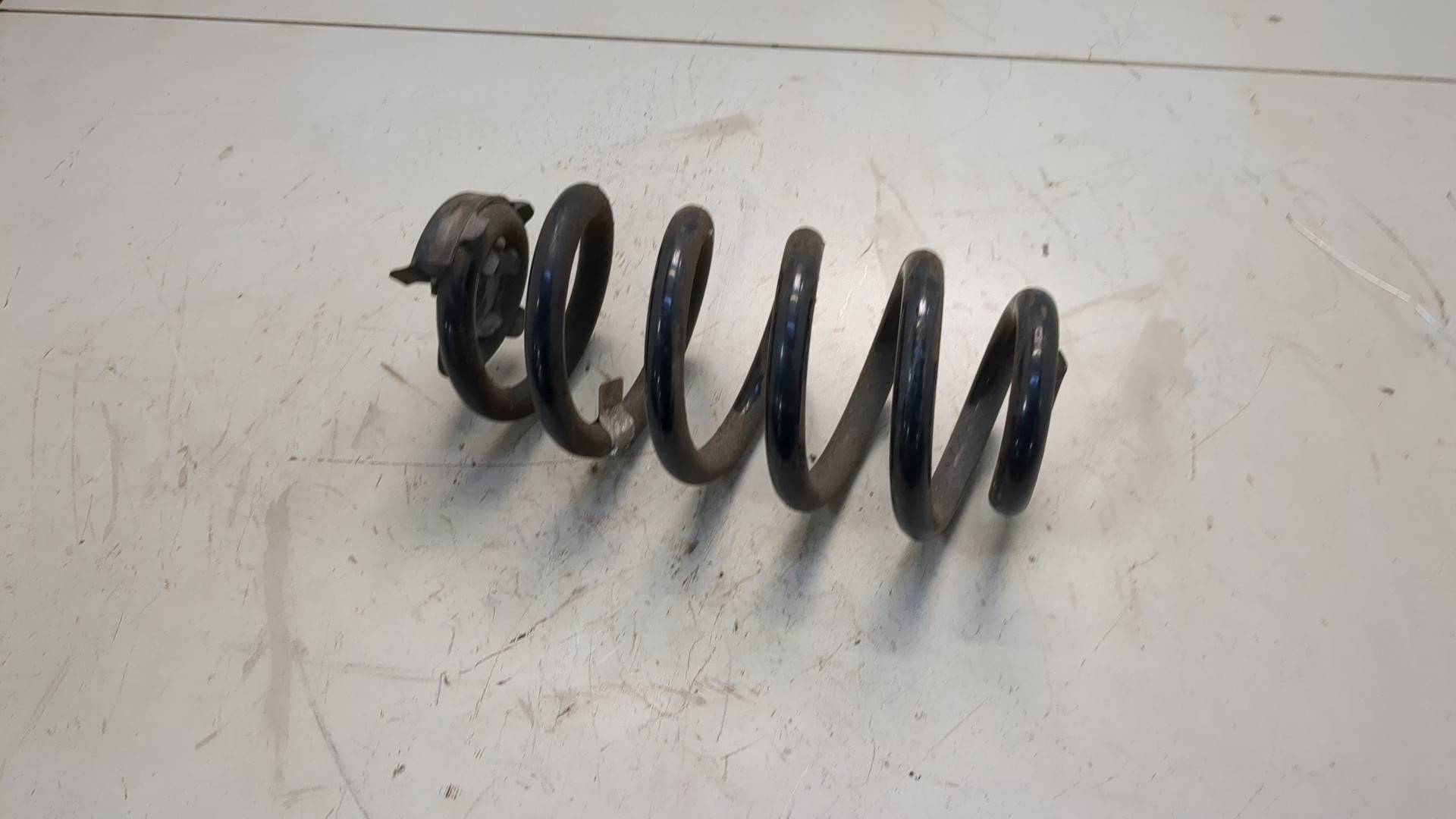 Пружина задняя