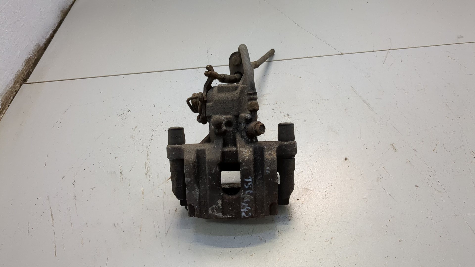 Суппорт задний левый