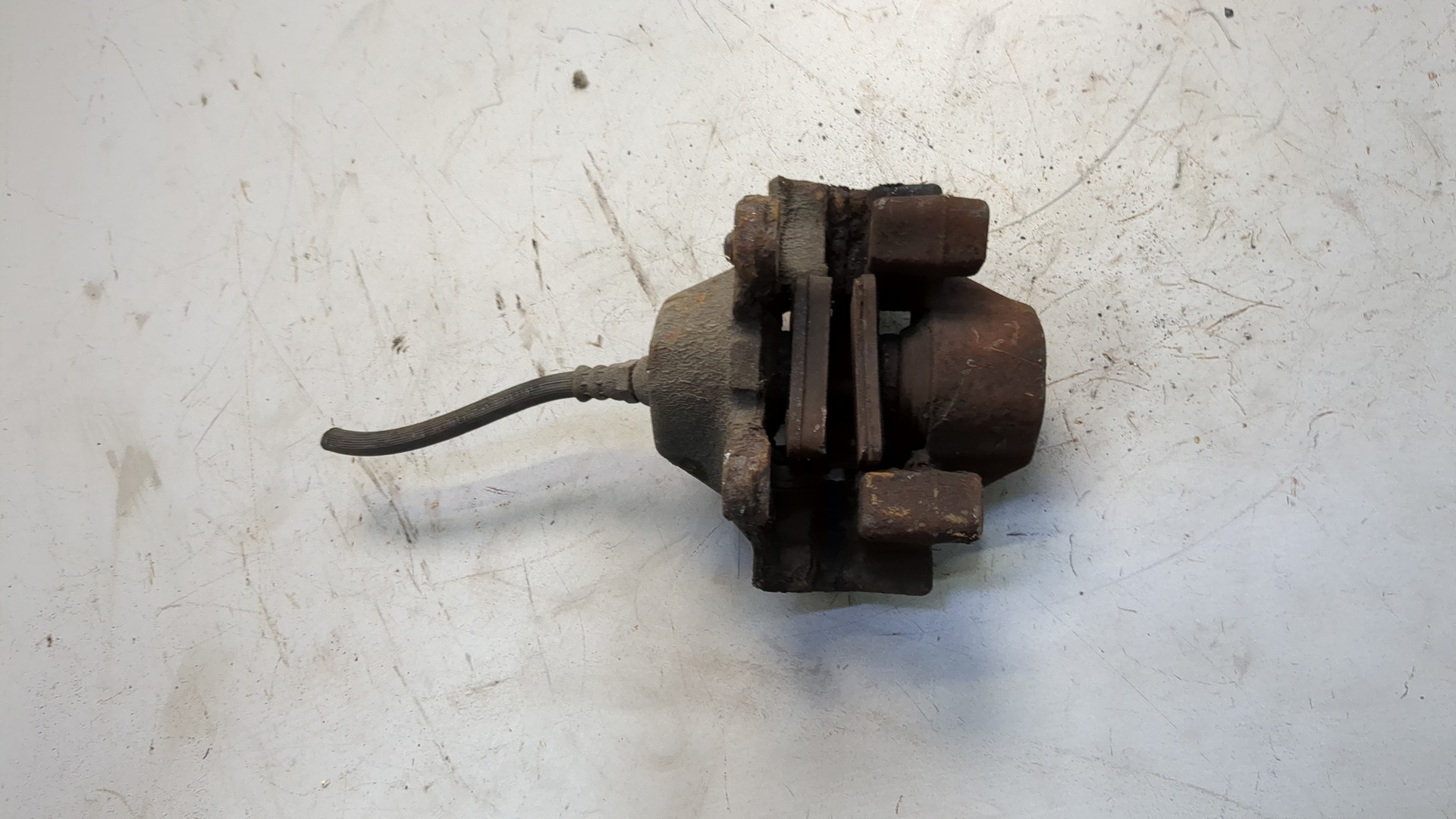 Суппорт задний левый