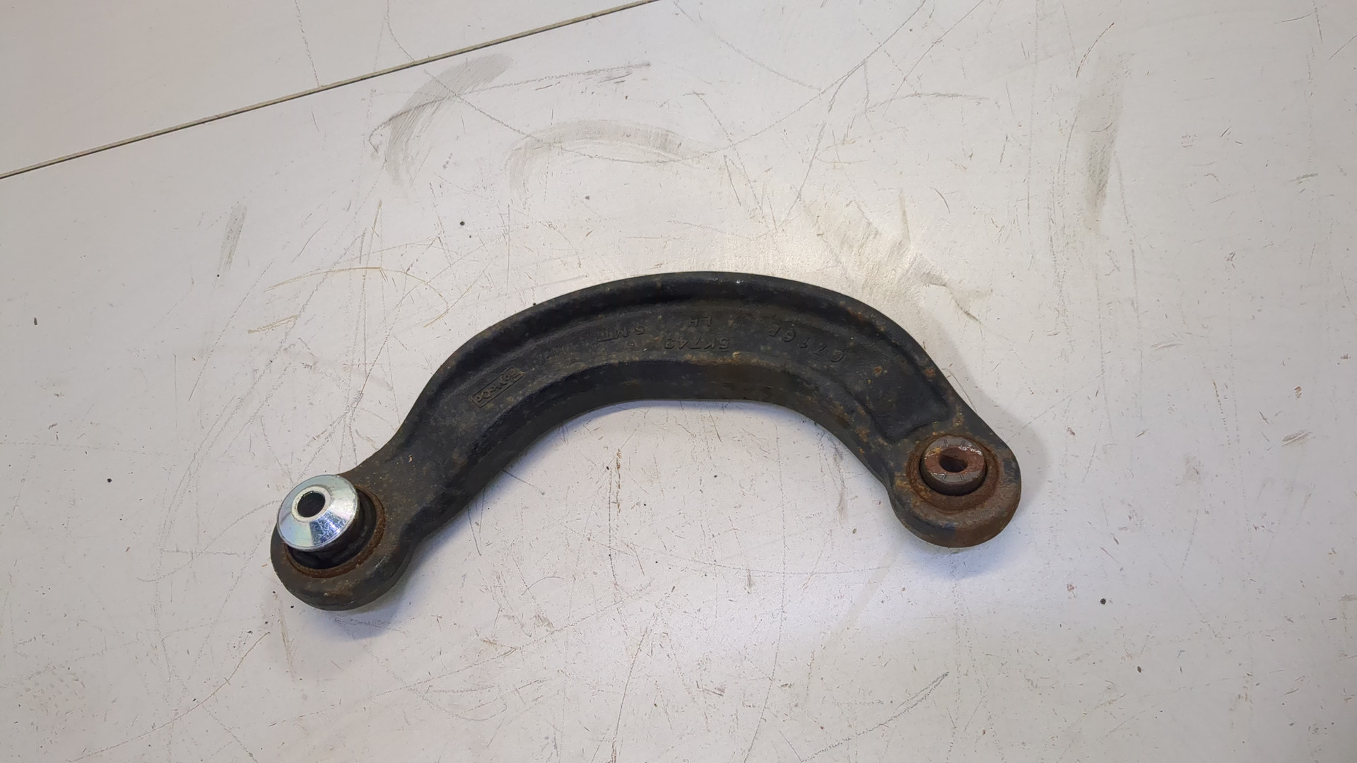 Рычаг задний левый