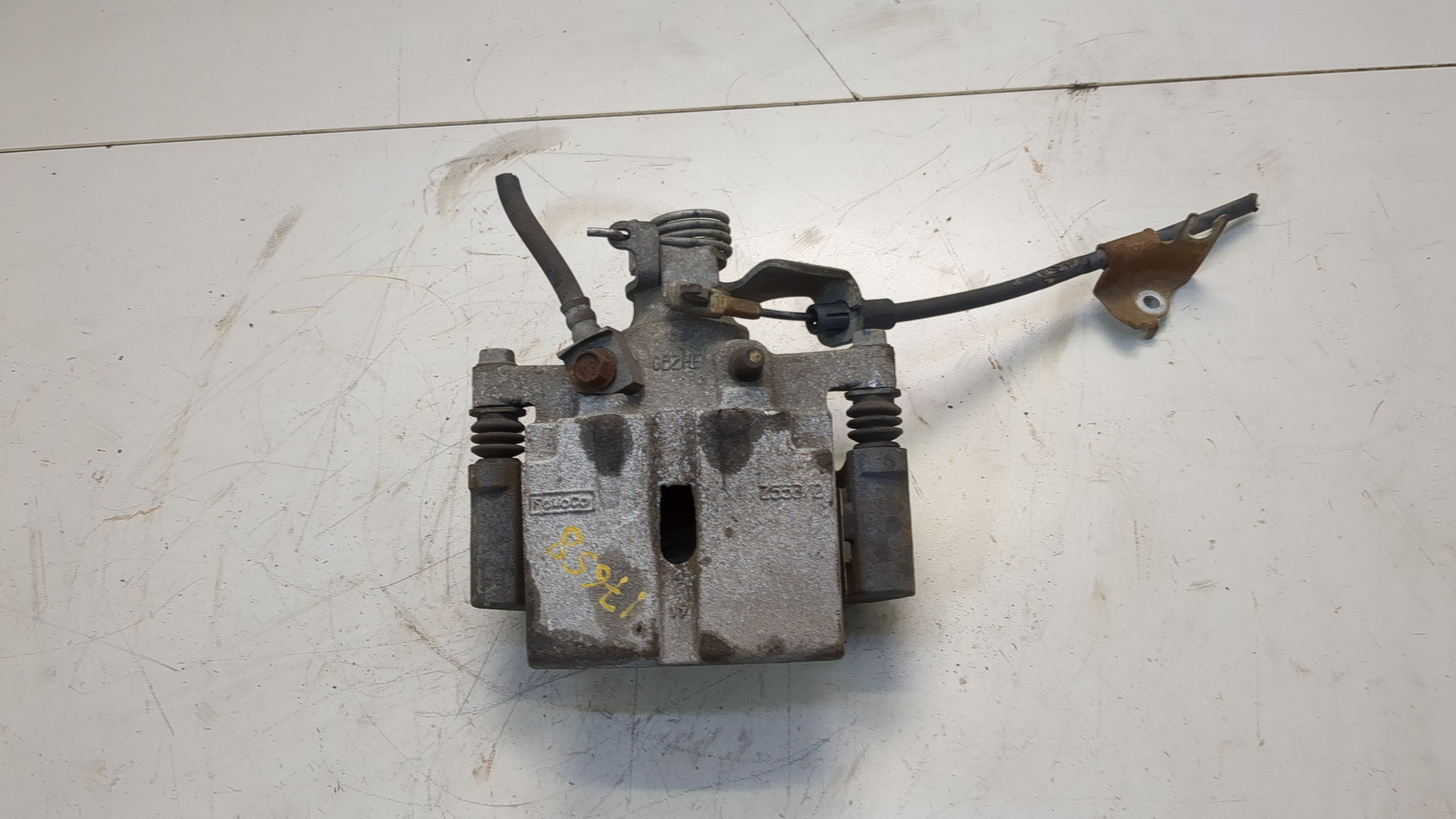 Суппорт задний левый