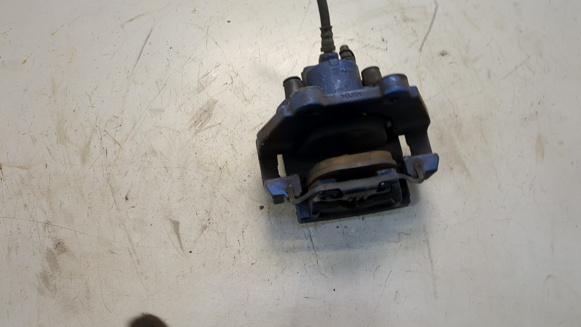 Суппорт задний левый