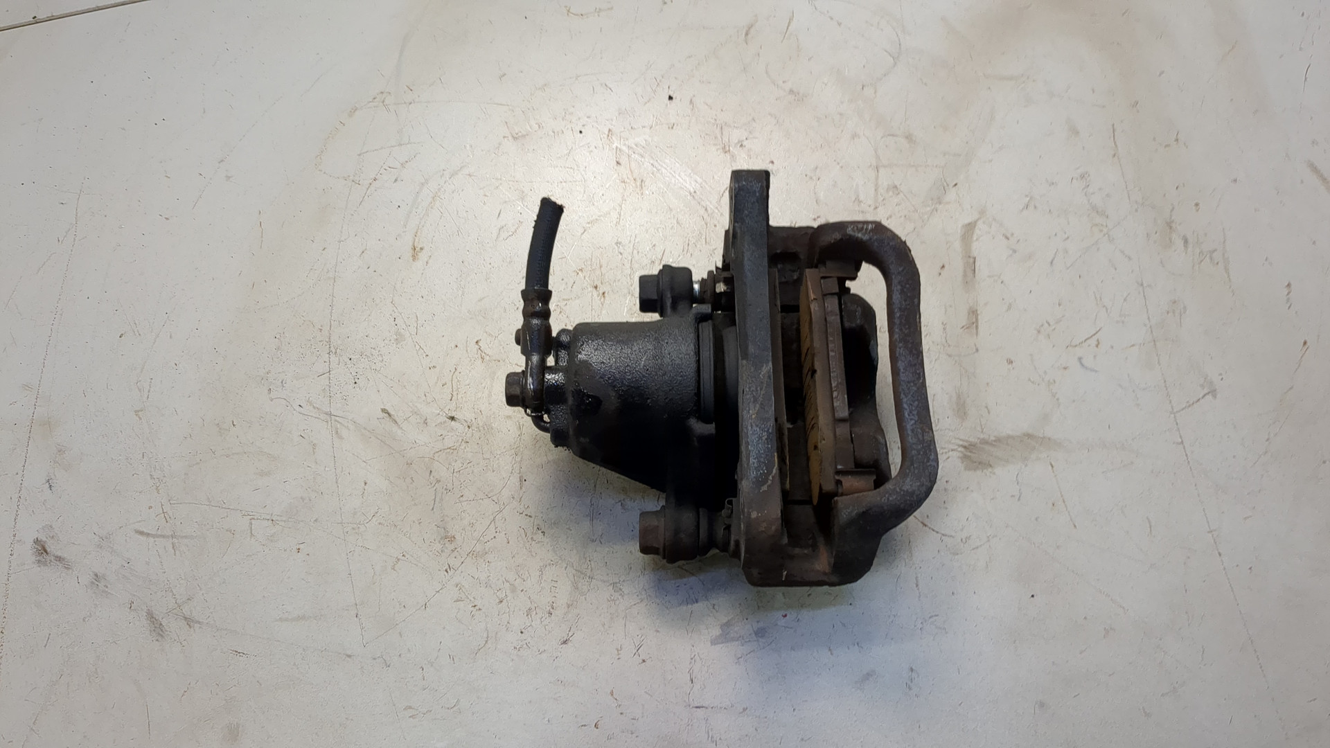 Суппорт задний левый