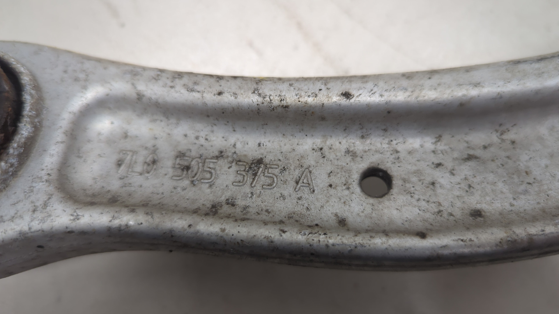 Рычаг задний левый