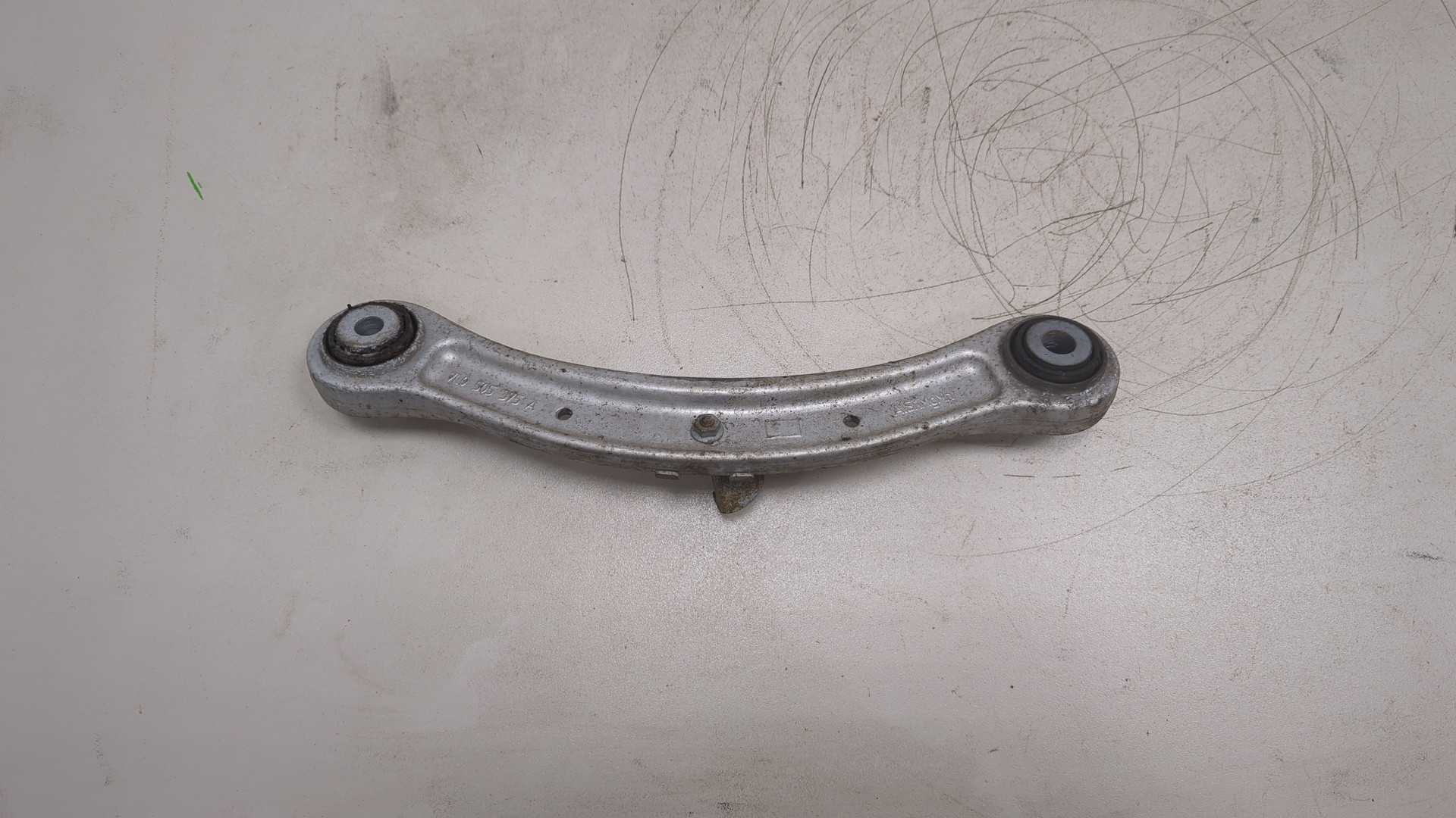 Рычаг задний левый