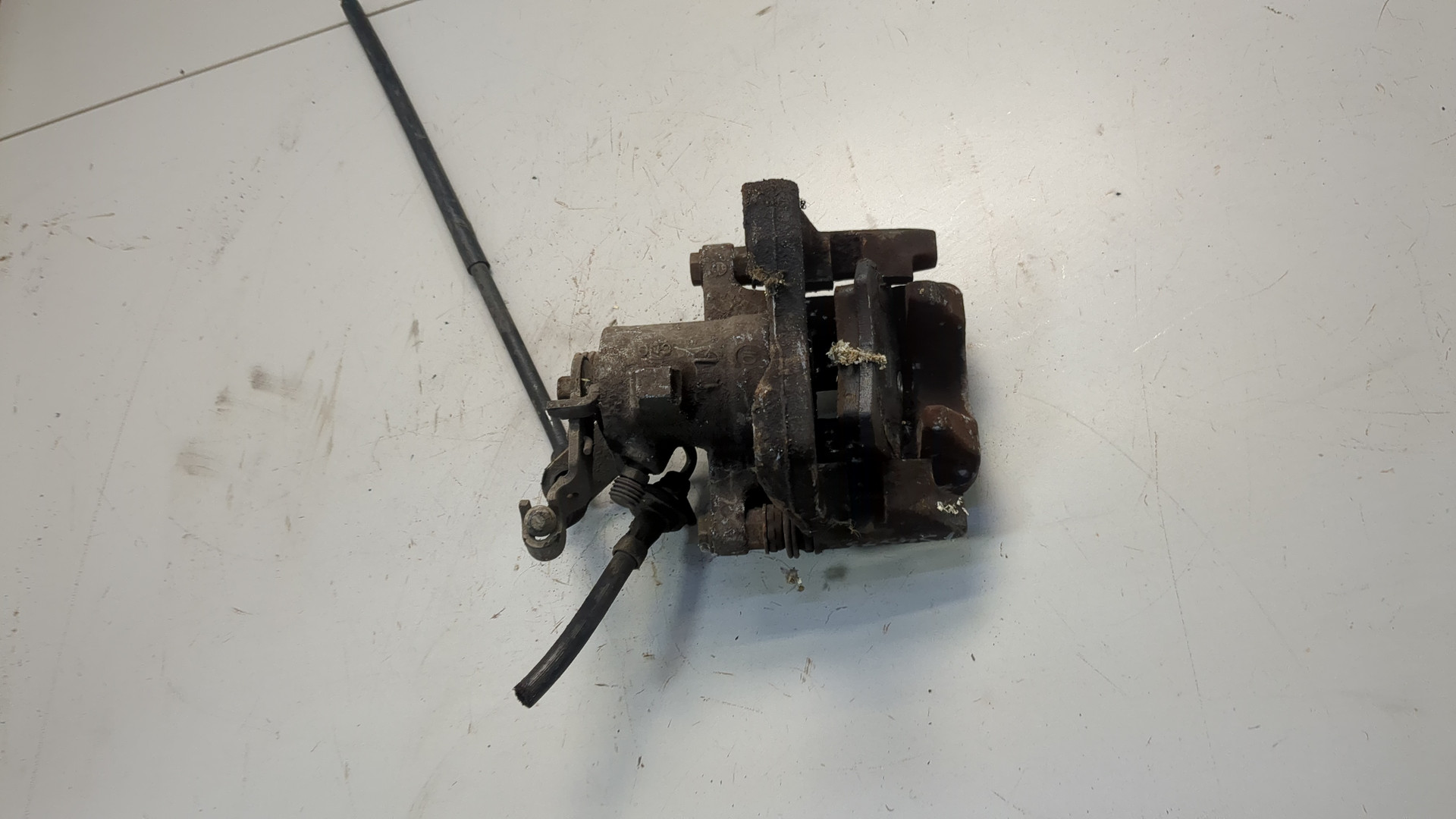 Суппорт задний левый