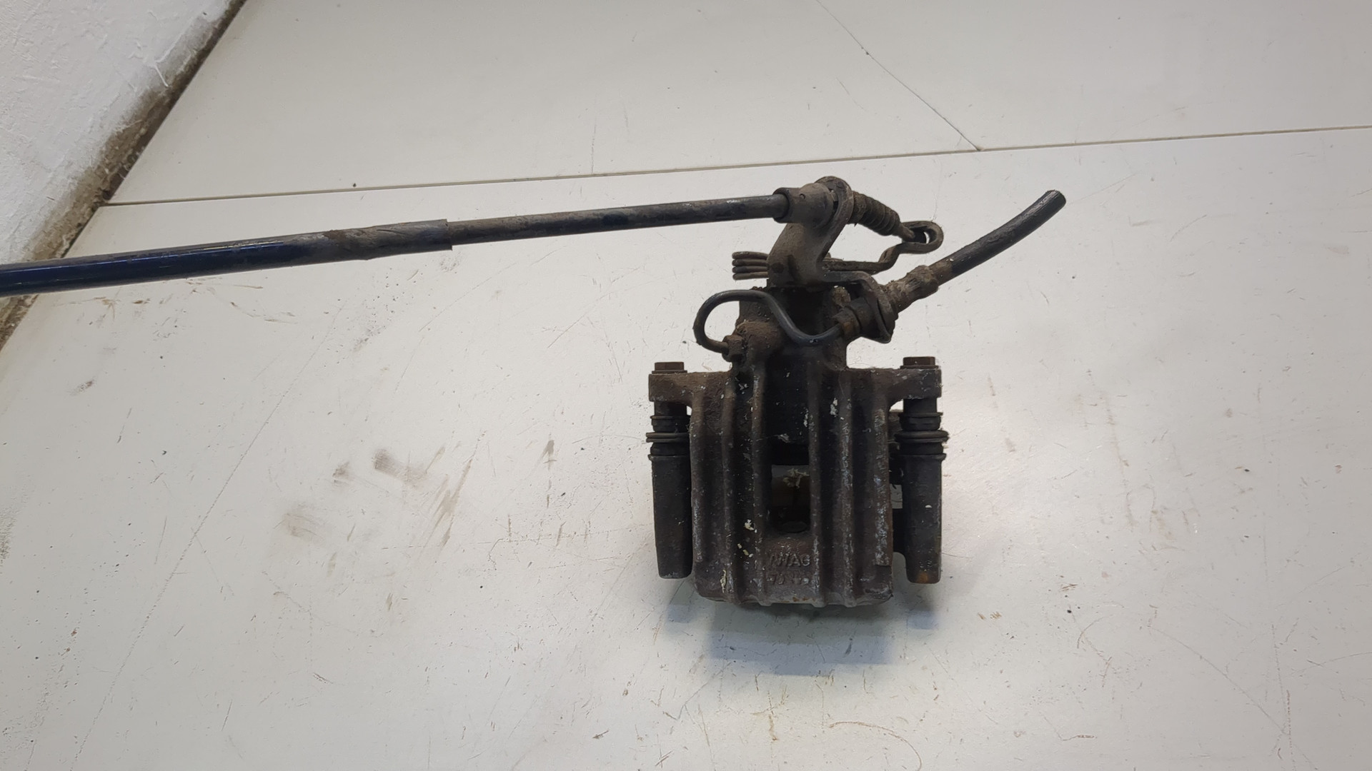 Суппорт задний левый