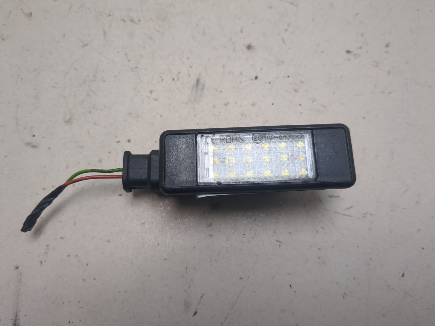 Фонарь подсветки номера