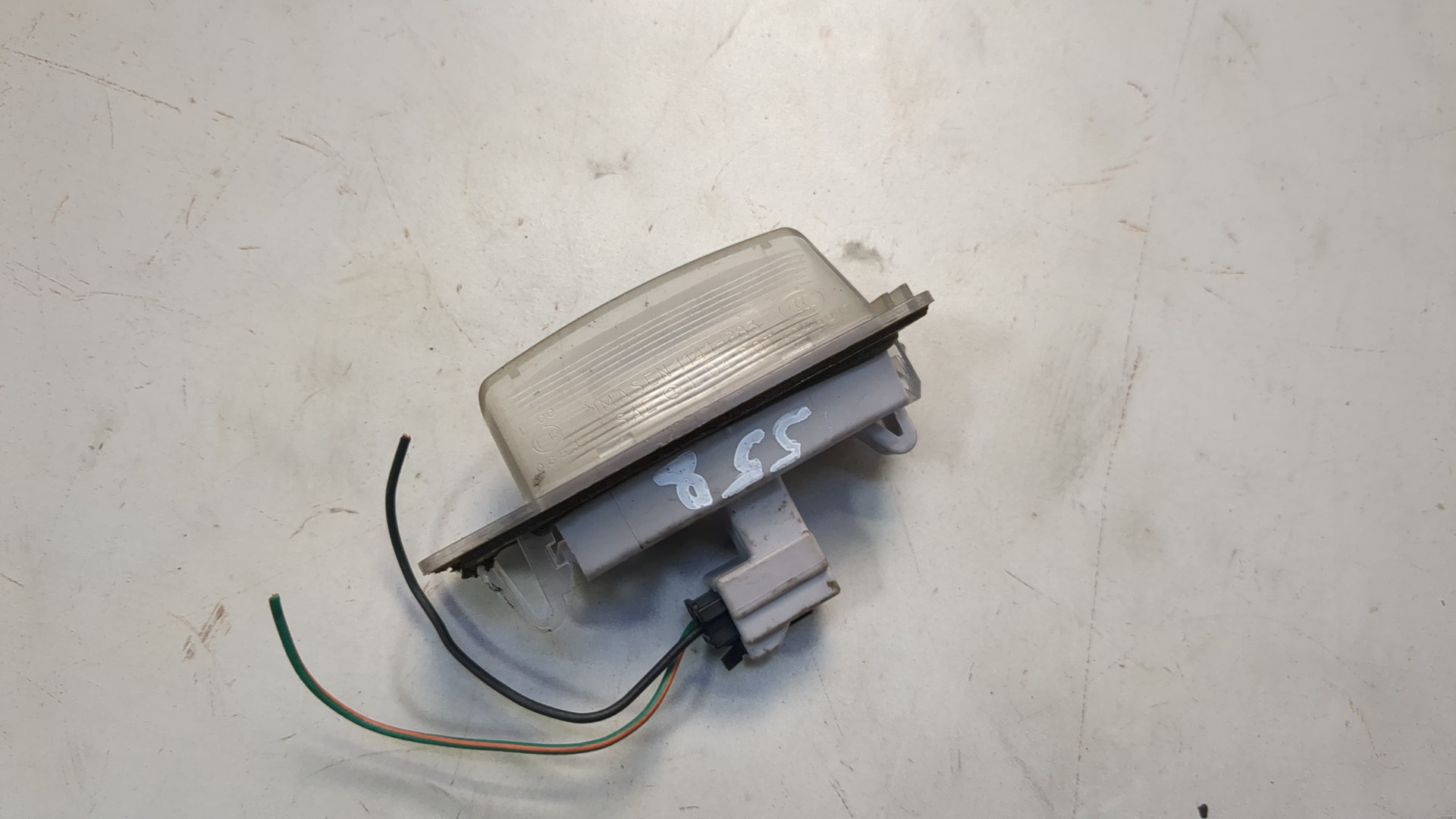 Фонарь подсветки номера