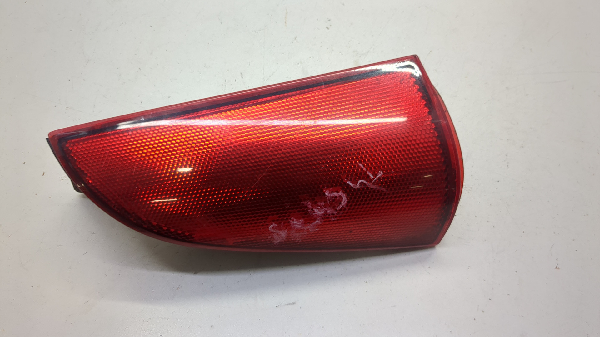 Отражатель в бампер задний левый