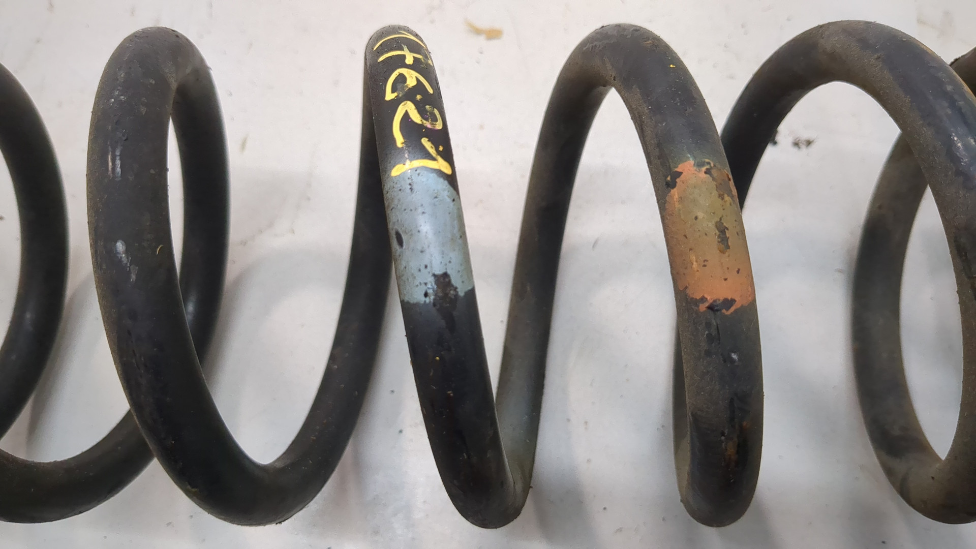 Пружина задняя