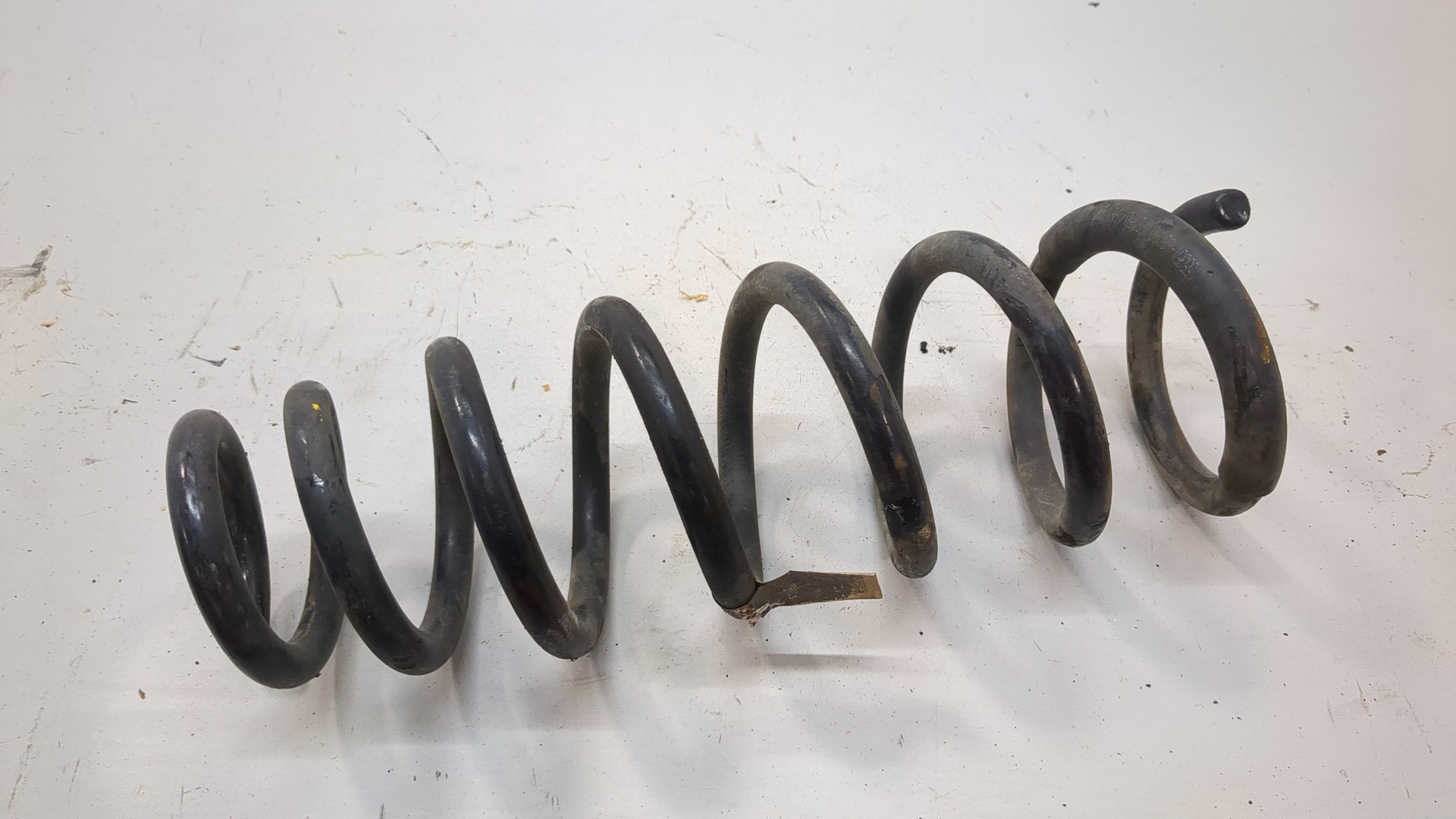 Пружина задняя