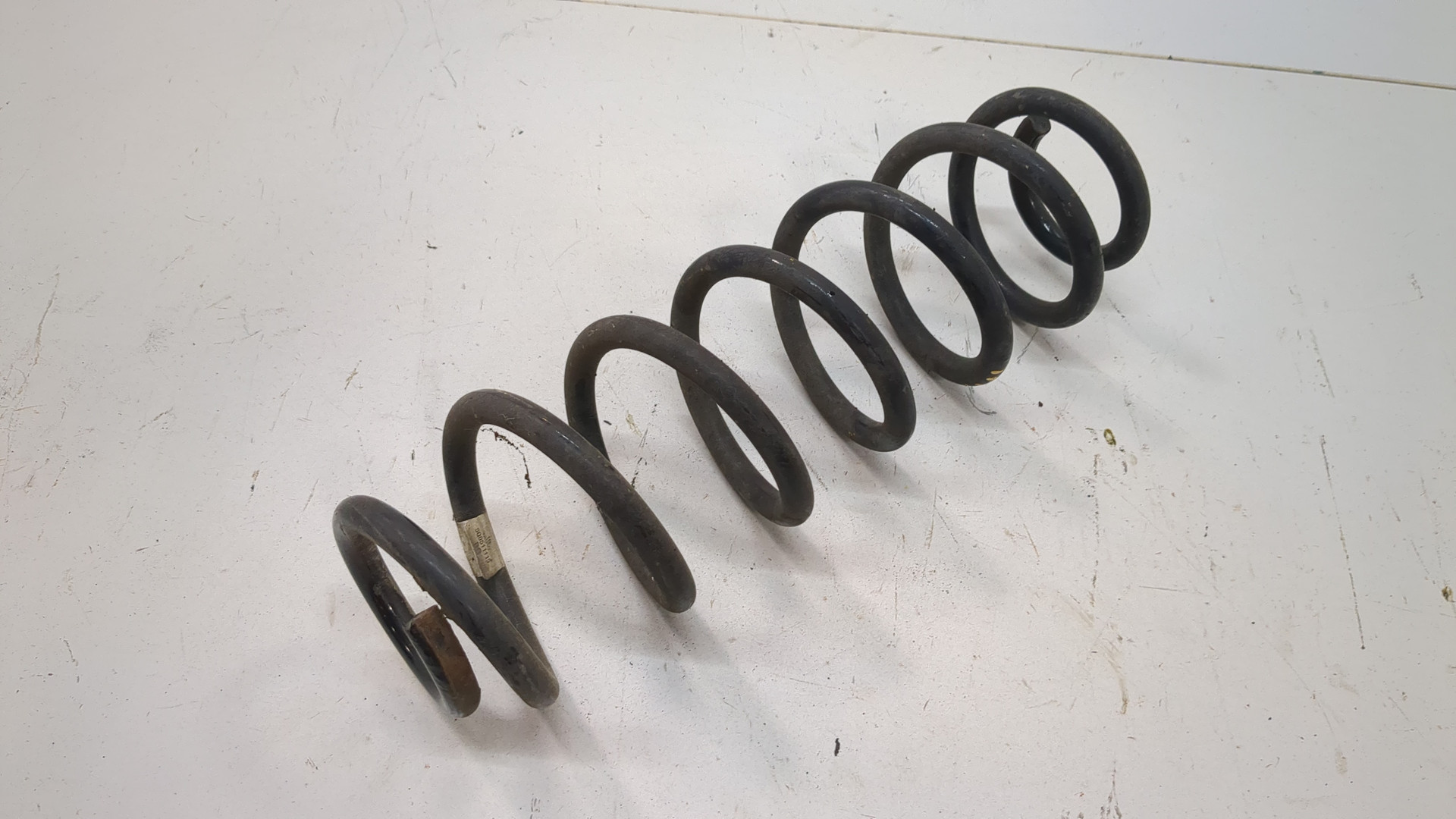 Пружина задняя