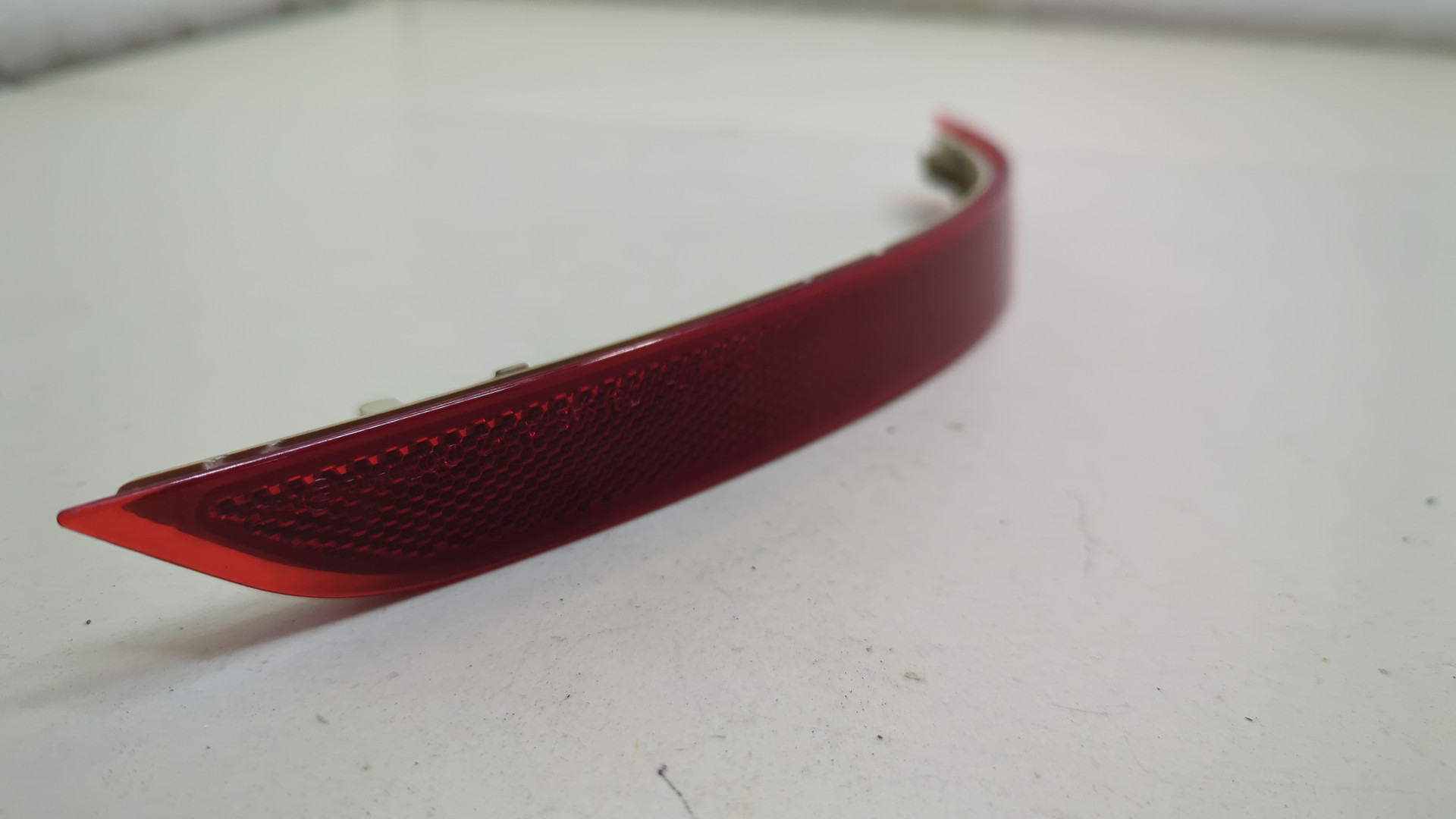 Отражатель в бампер задний левый