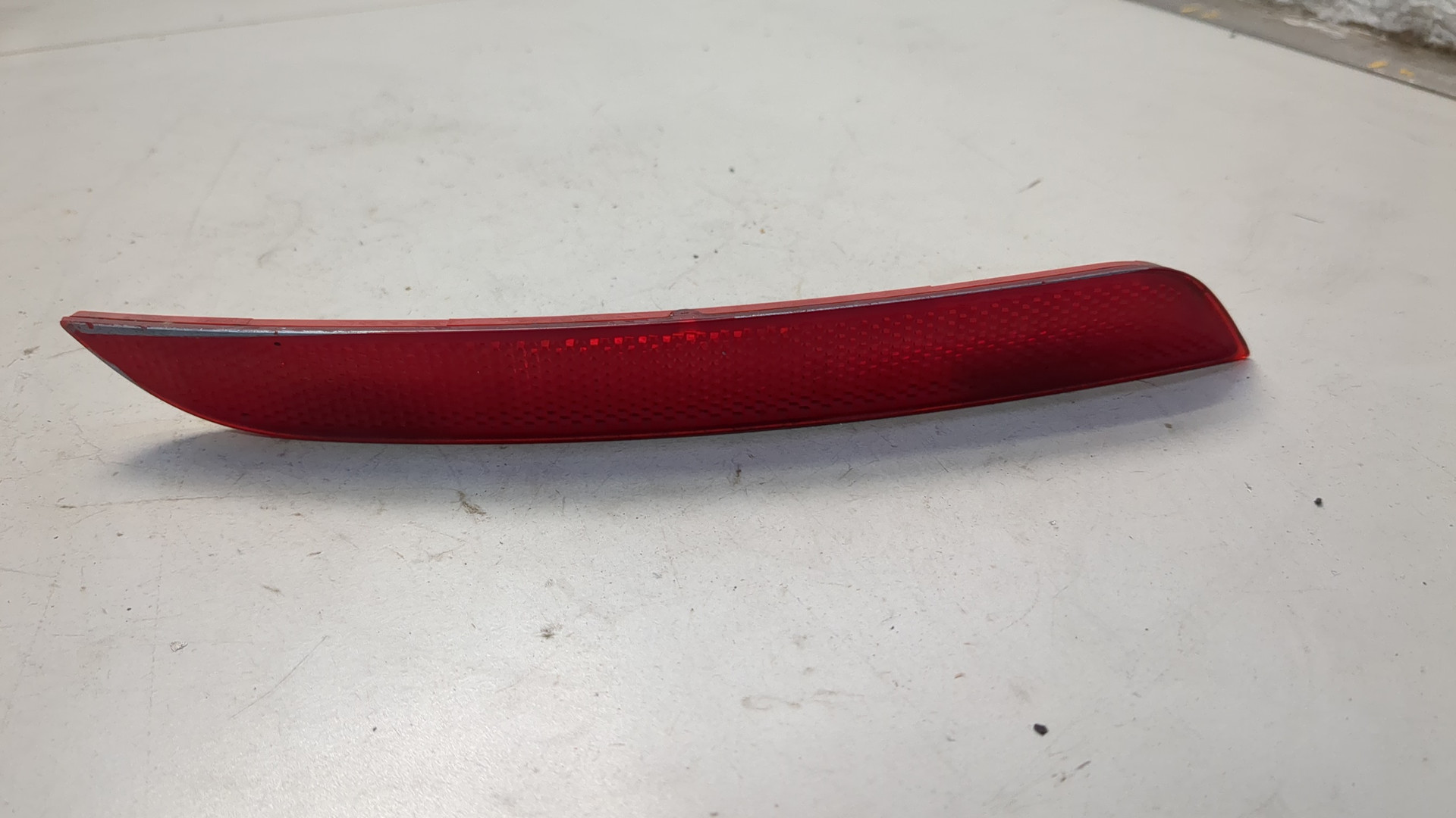 Отражатель в бампер задний левый