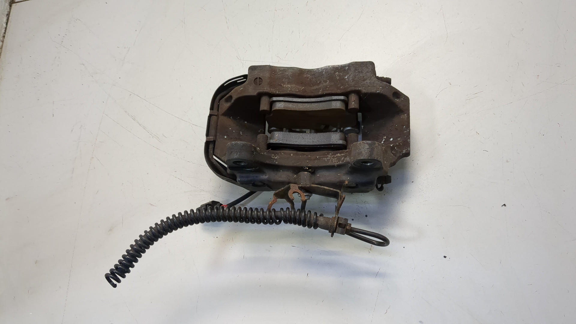 Суппорт задний левый