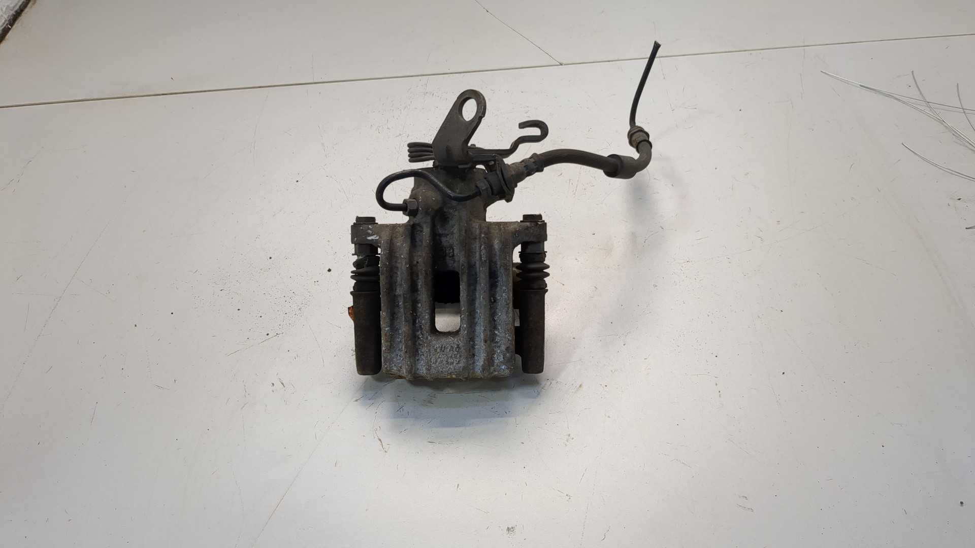 Суппорт задний левый