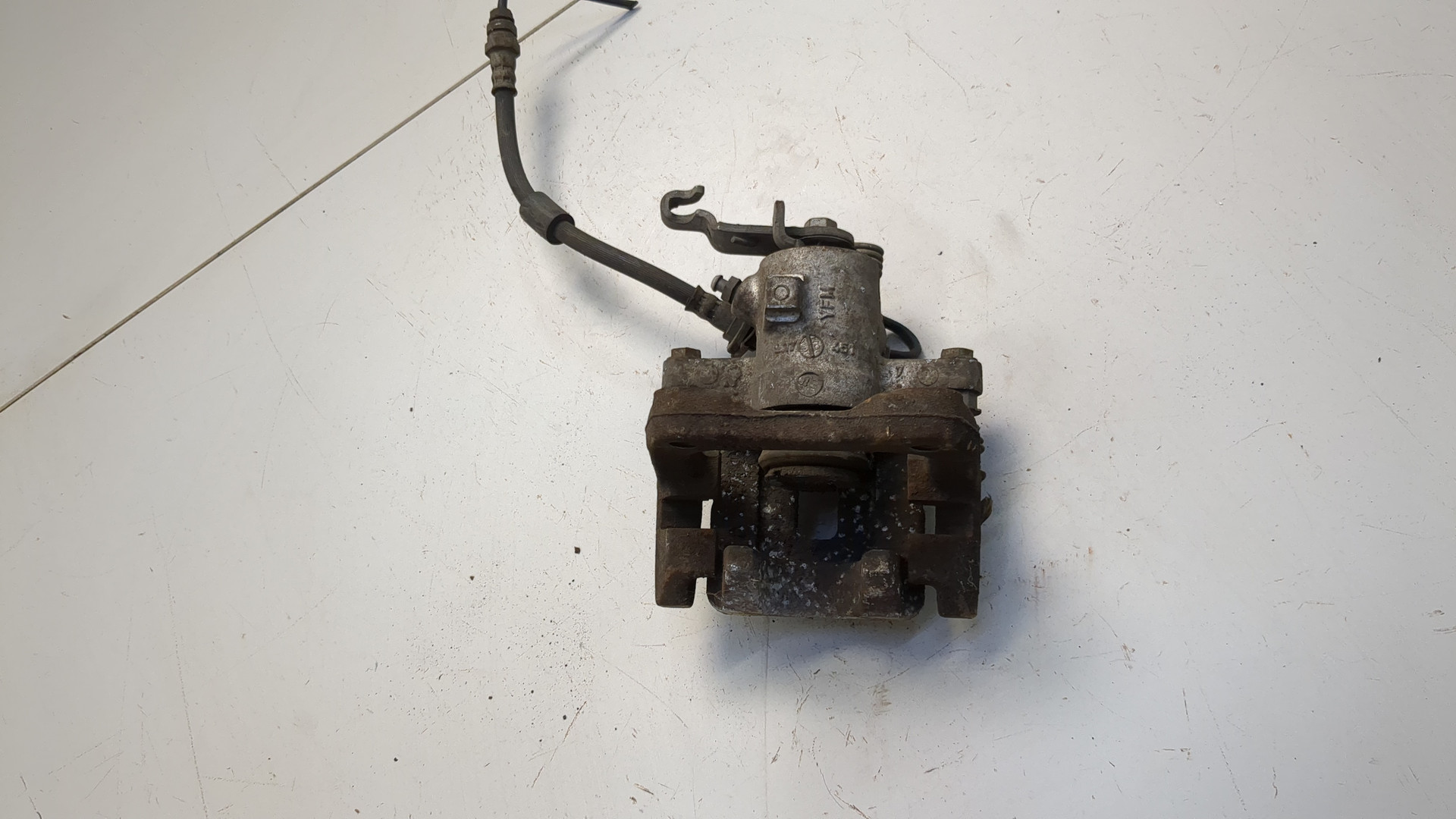 Суппорт задний левый