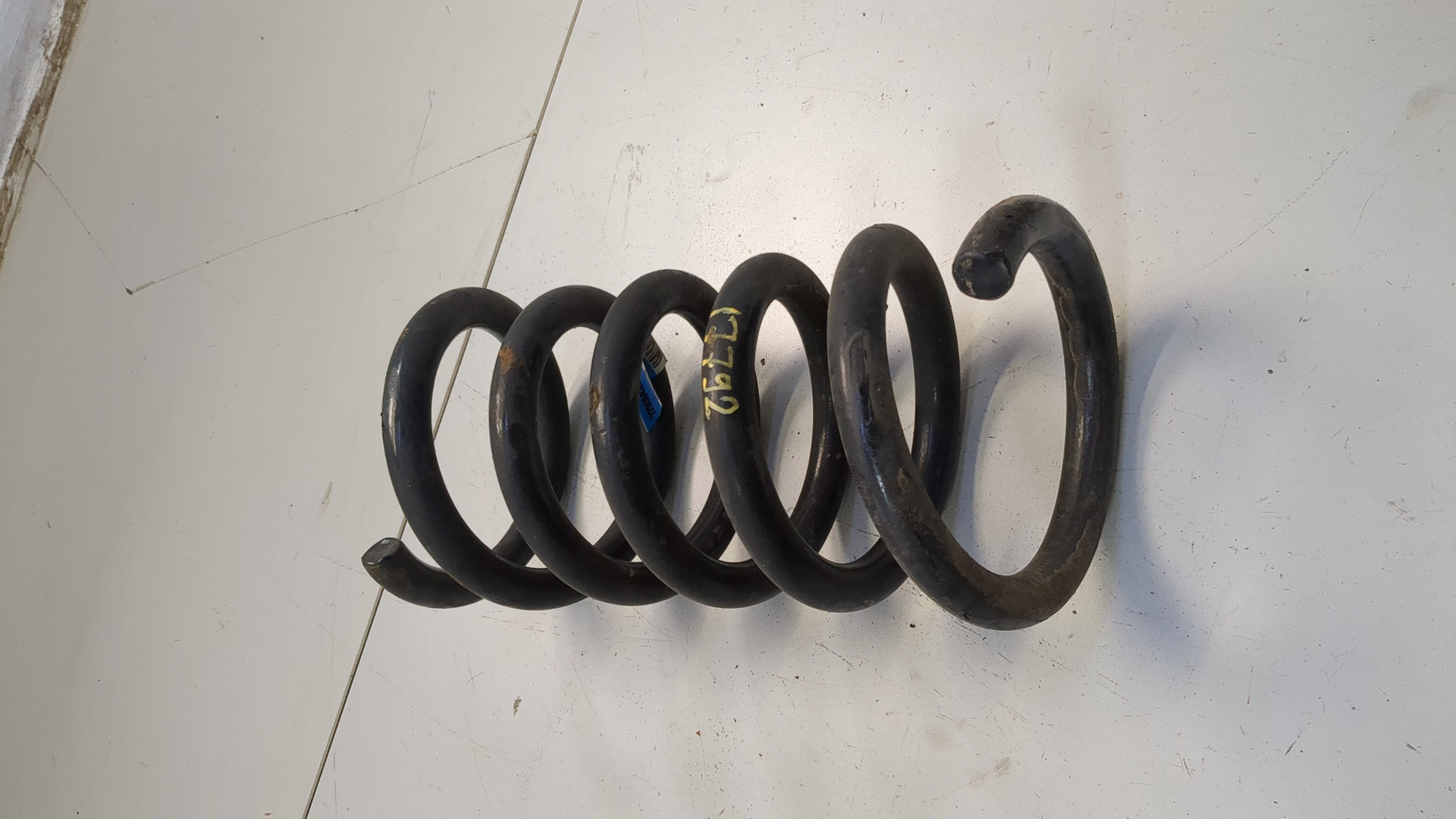 Пружина задняя