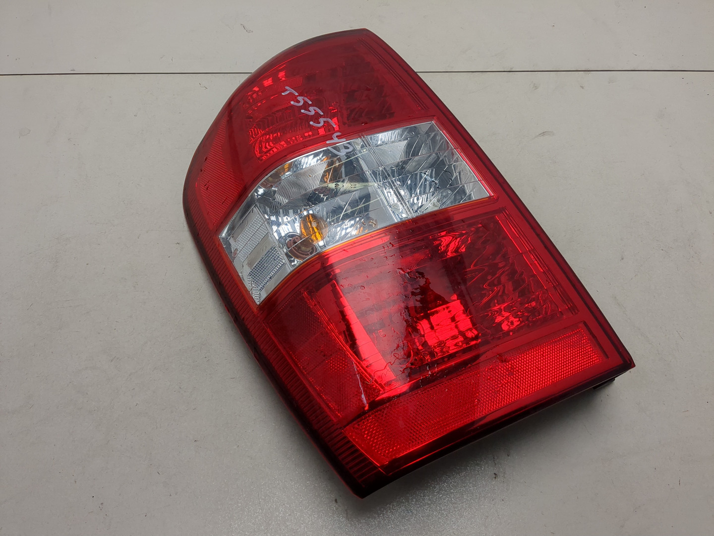 Фонарь задний левый