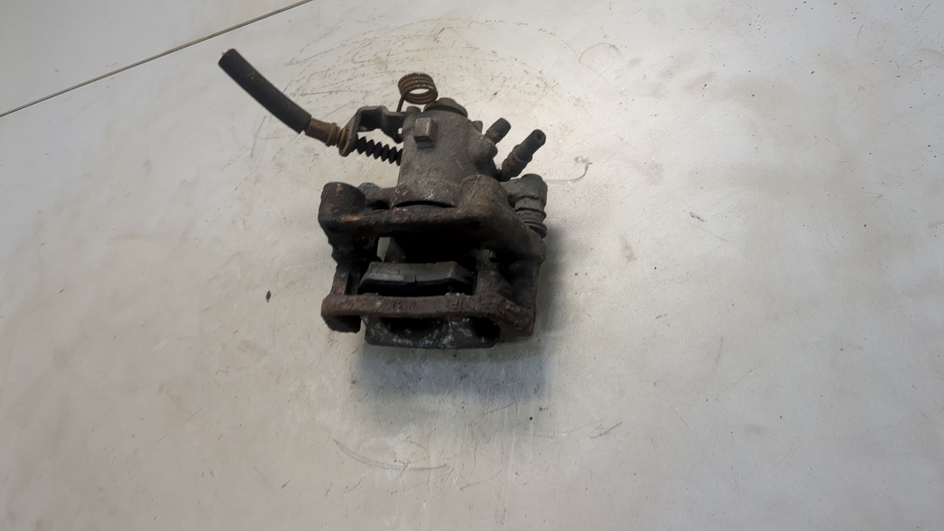 Суппорт задний левый