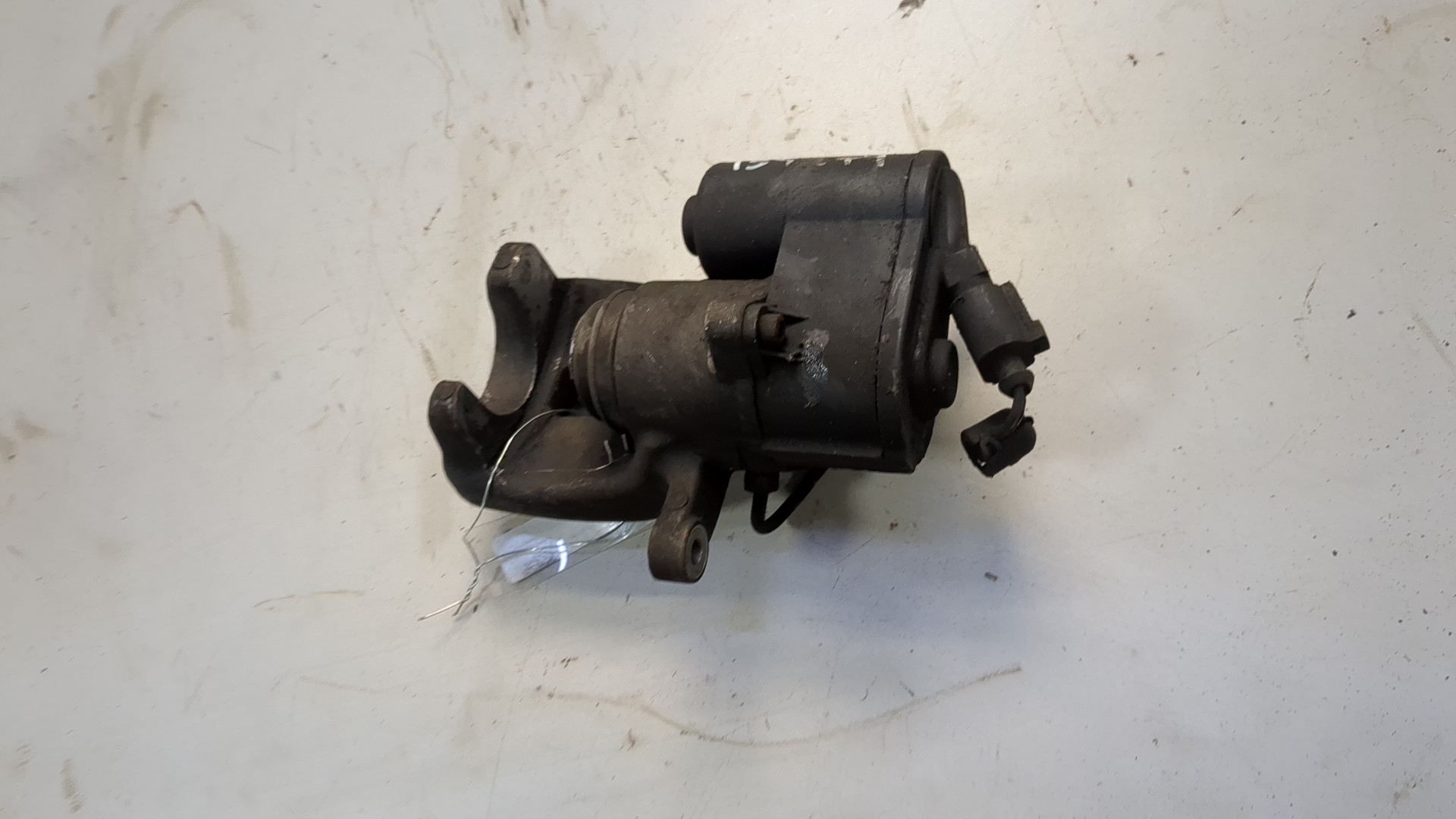 Суппорт задний левый