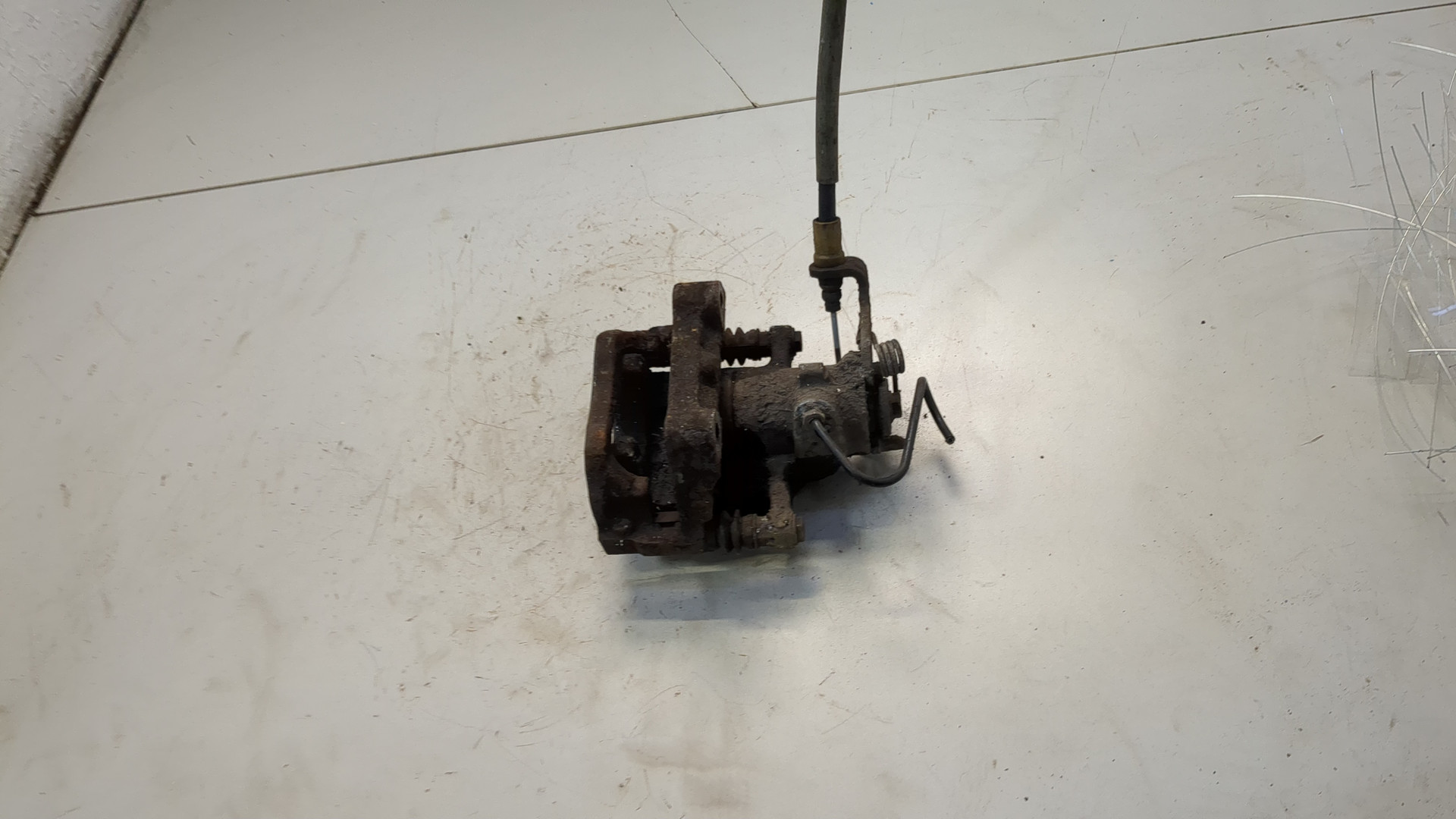 Суппорт задний левый