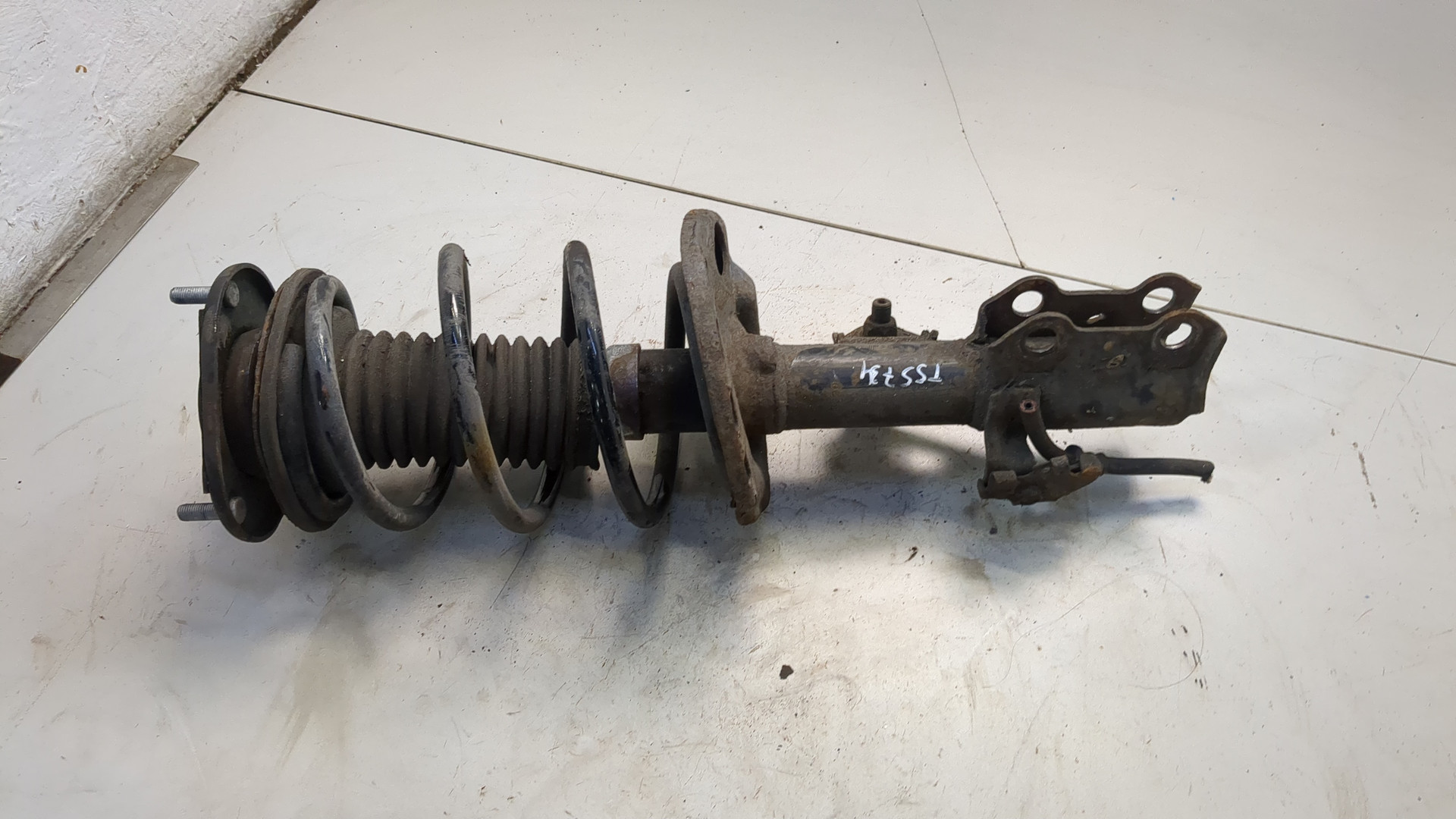 Амортизатор передний левый