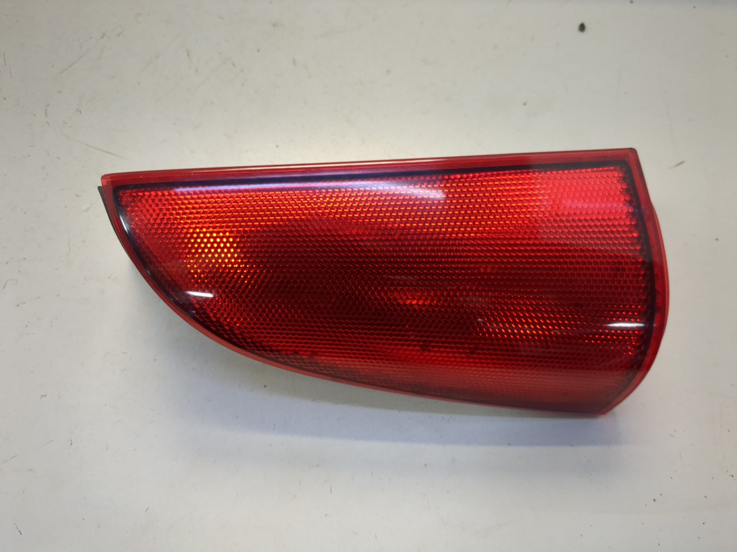 Отражатель в бампер задний левый