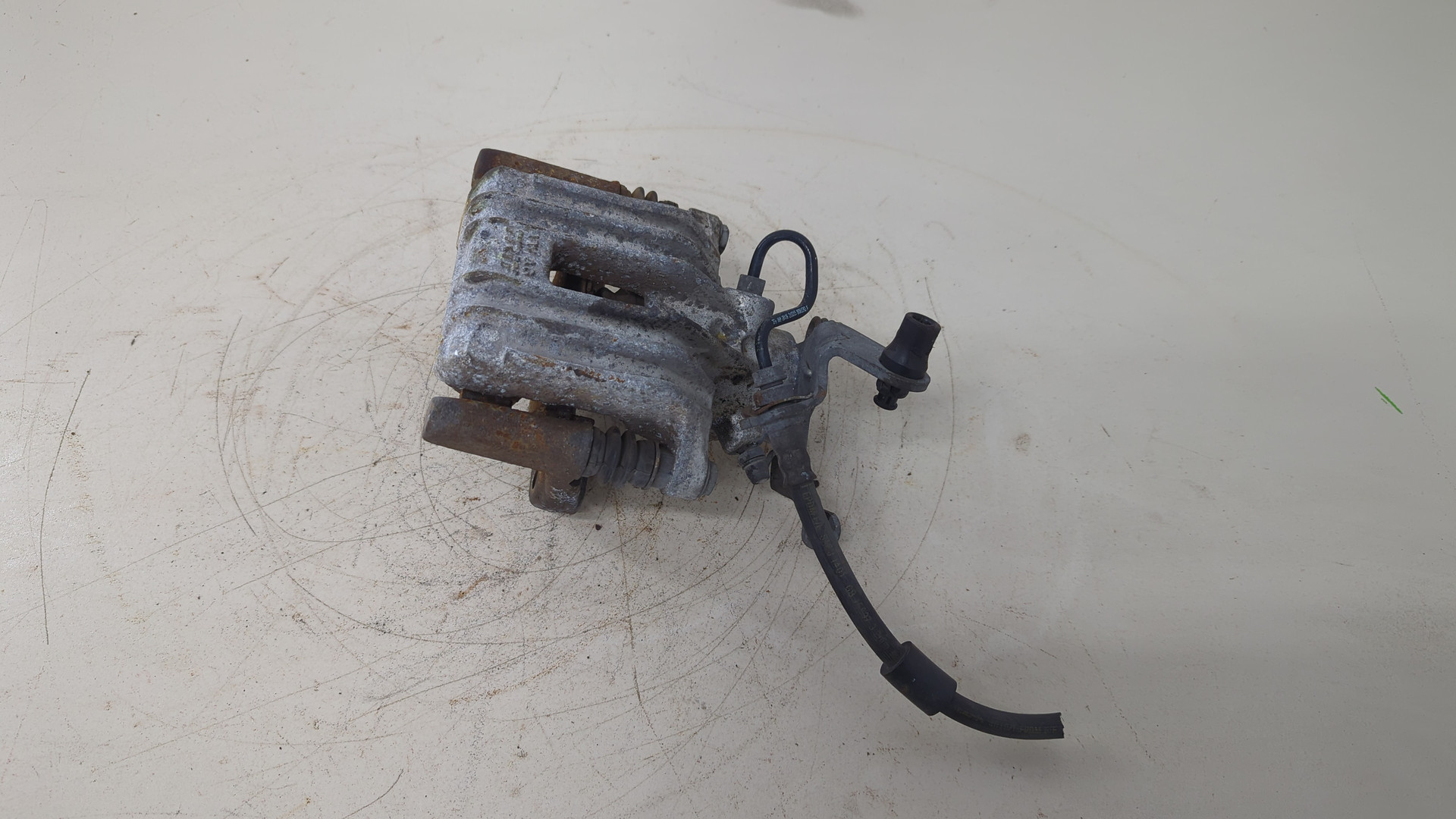 Суппорт задний левый