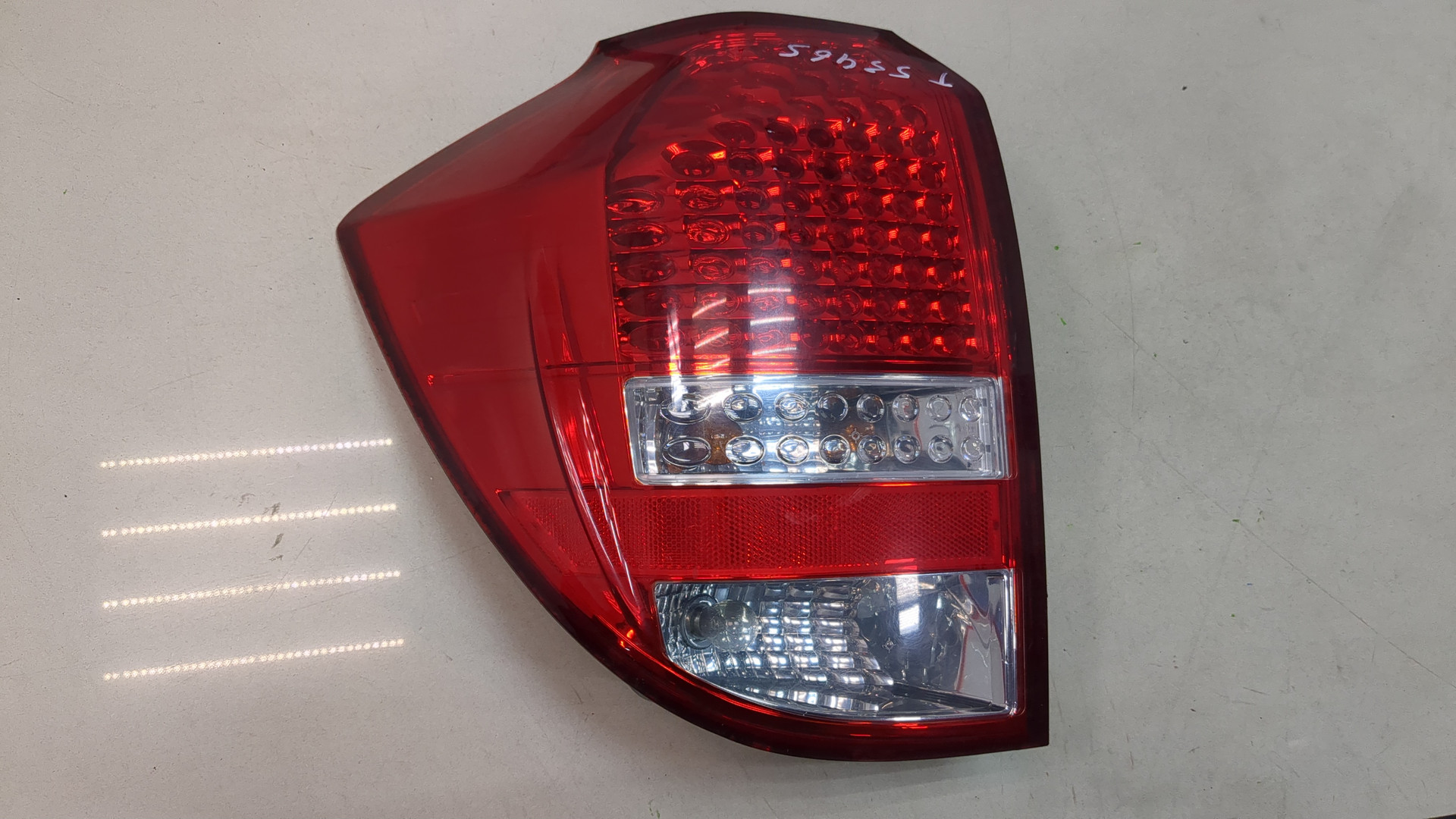 Фонарь задний левый