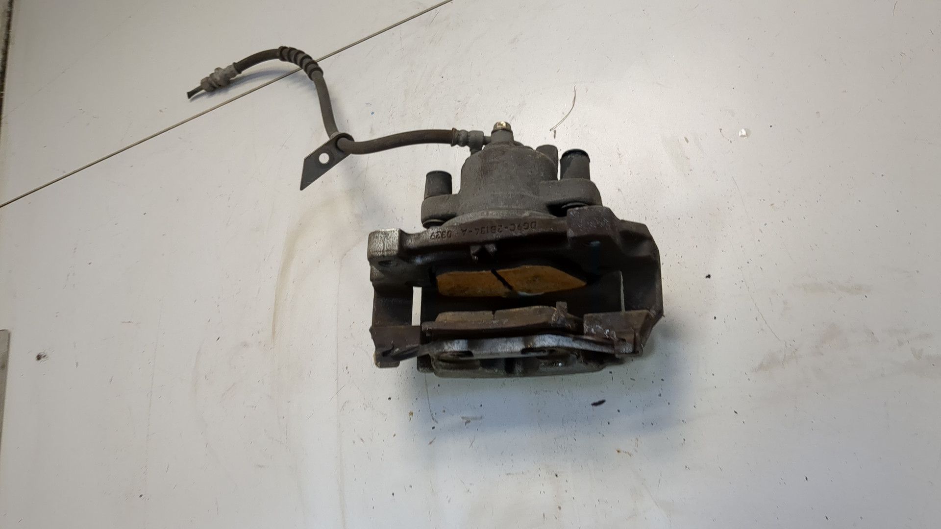 Суппорт передний левый