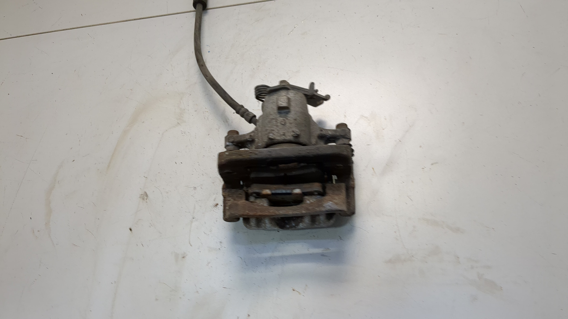 Суппорт задний левый