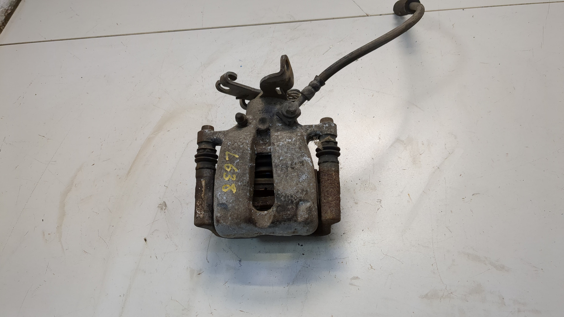 Суппорт задний левый